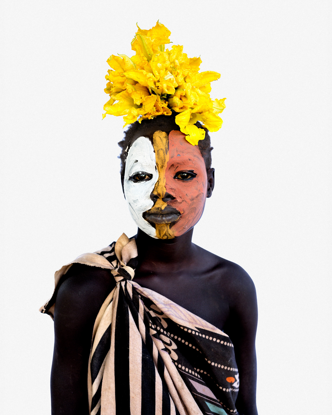 Portrait of a young woman from the Suri community with traditional body painting, Lower Omo Valley, Ethiopia, 2025.