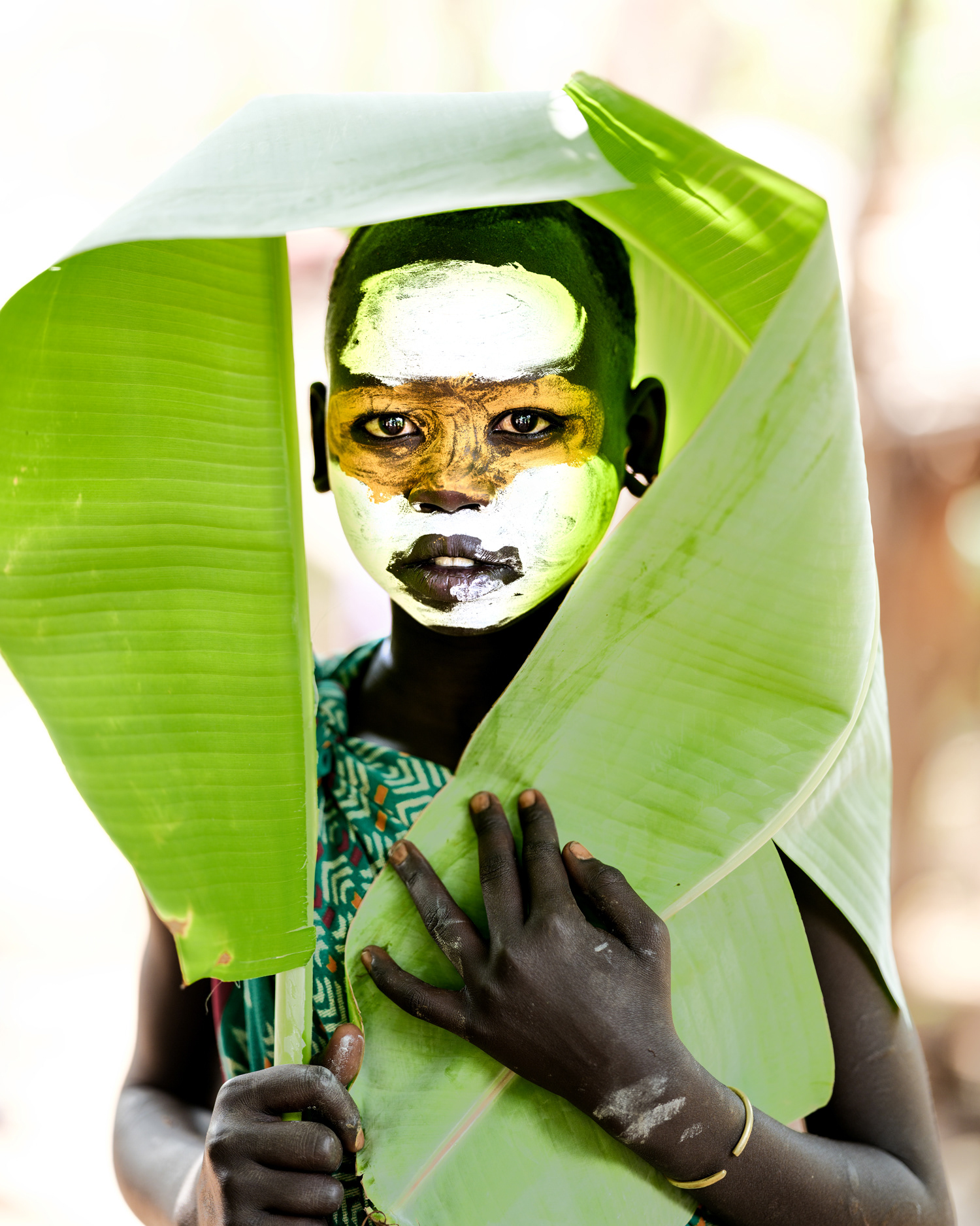 Portrait of a young woman from the Suri community with traditional body painting, Lower Omo Valley, Ethiopia, 2025.