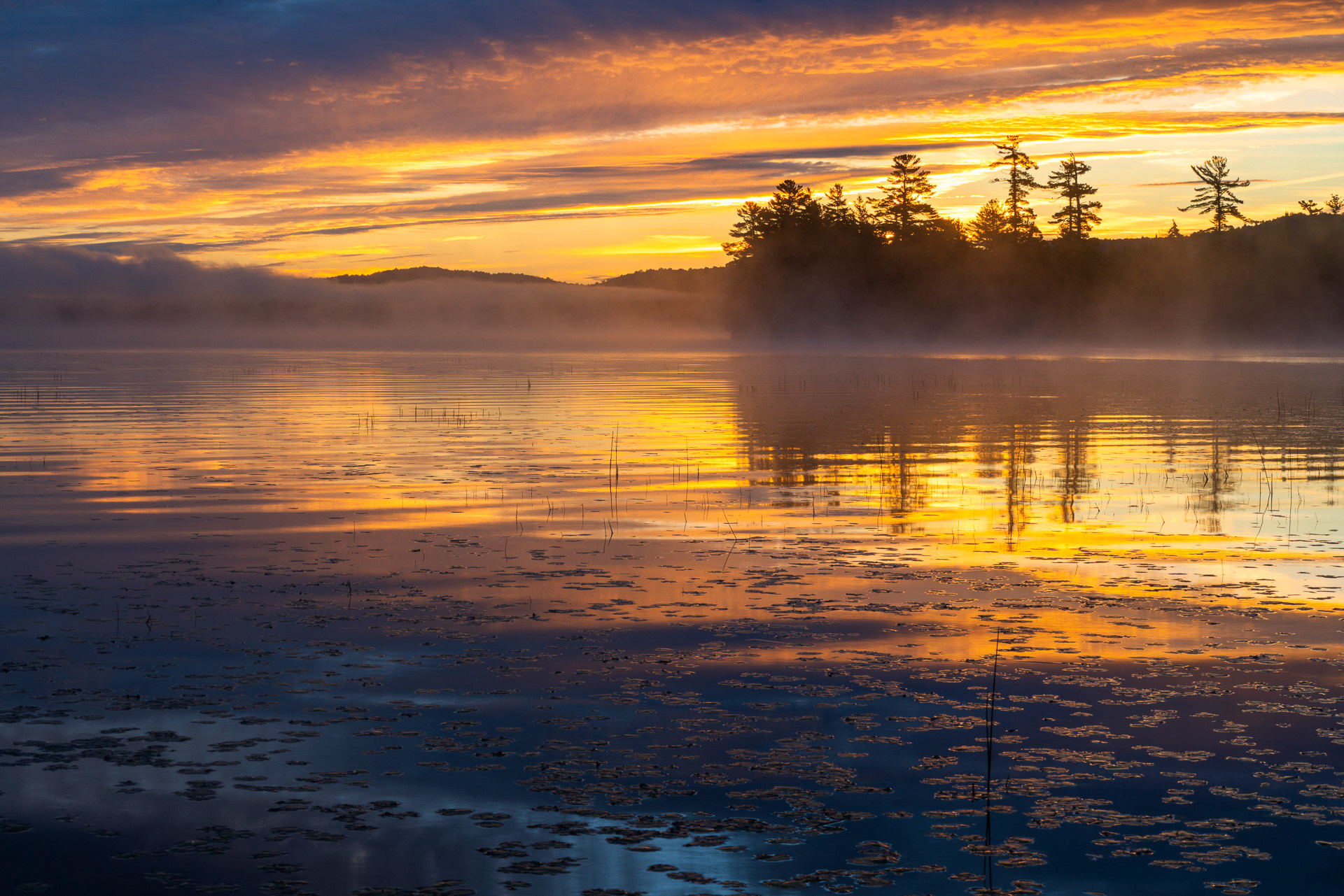 27 September 2018: Sunrise at Raquette Lake in the Adirondack Mountains, NY.
