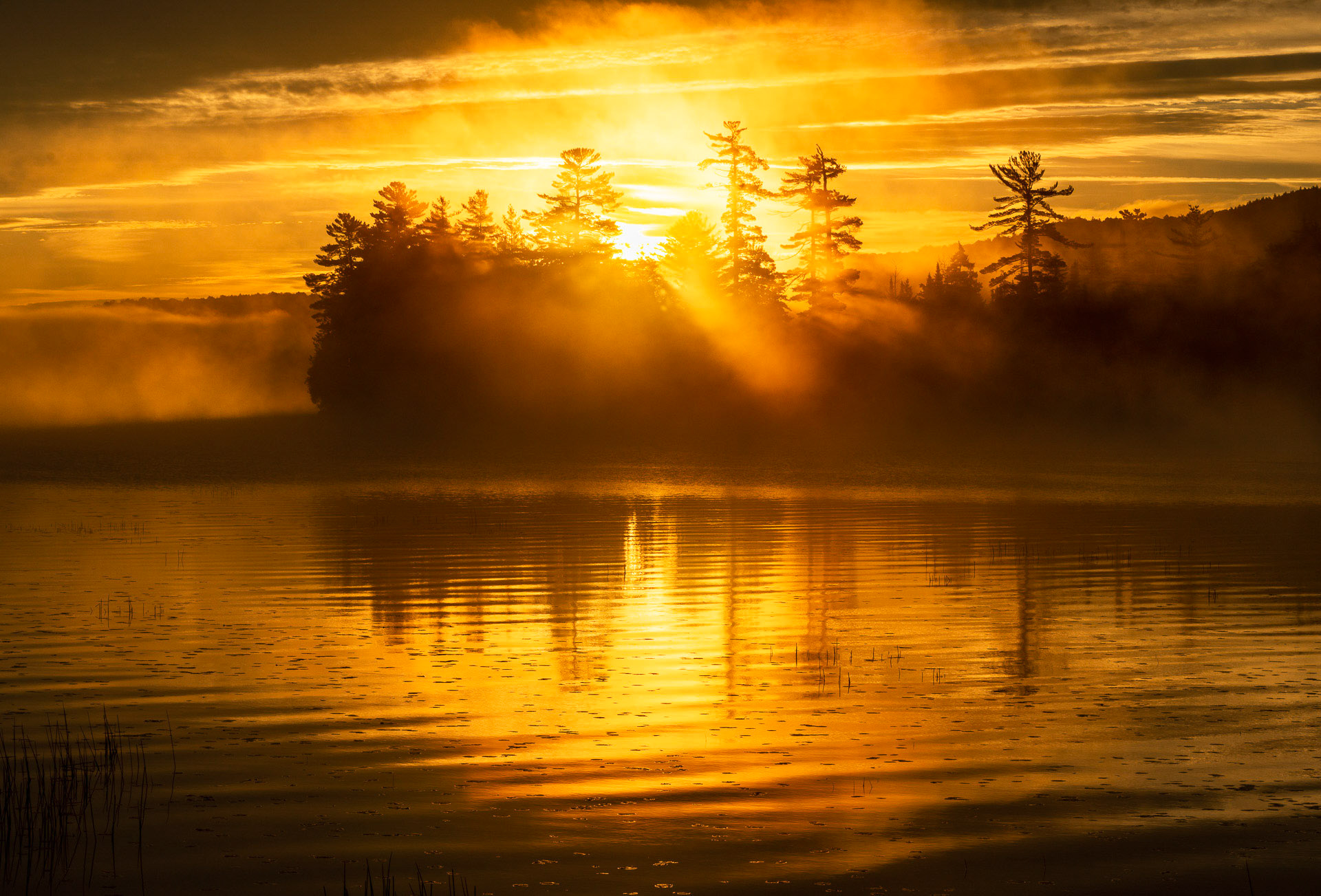 27 September 2018: Sunrise at Raquette Lake in the Adirondack Mountains, NY.