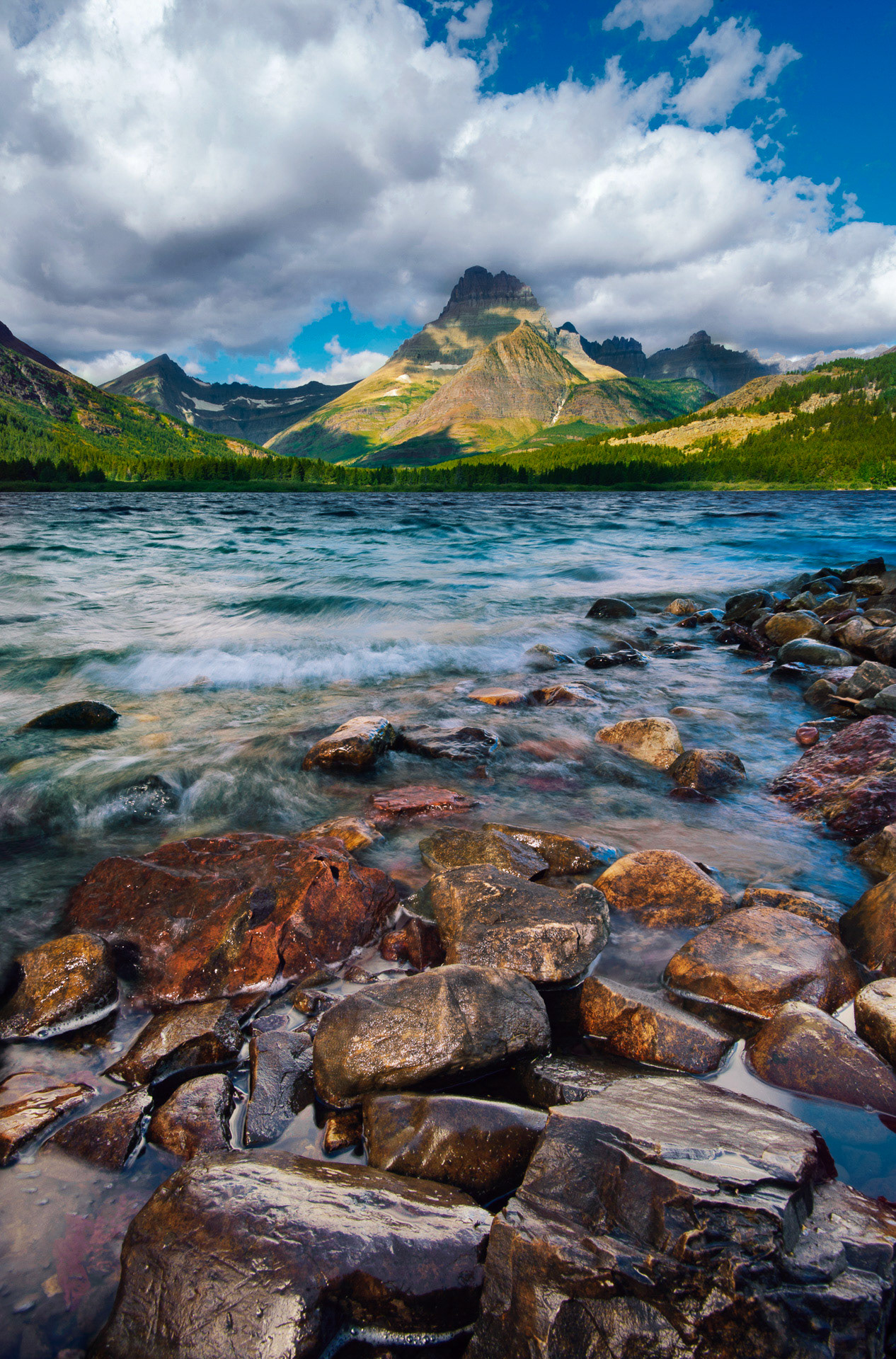 29 August 2012: Swiftcurrent Lake in front of Mt. Wilbur and Iceberg Peak and during the morning in Glacier National Park, MT