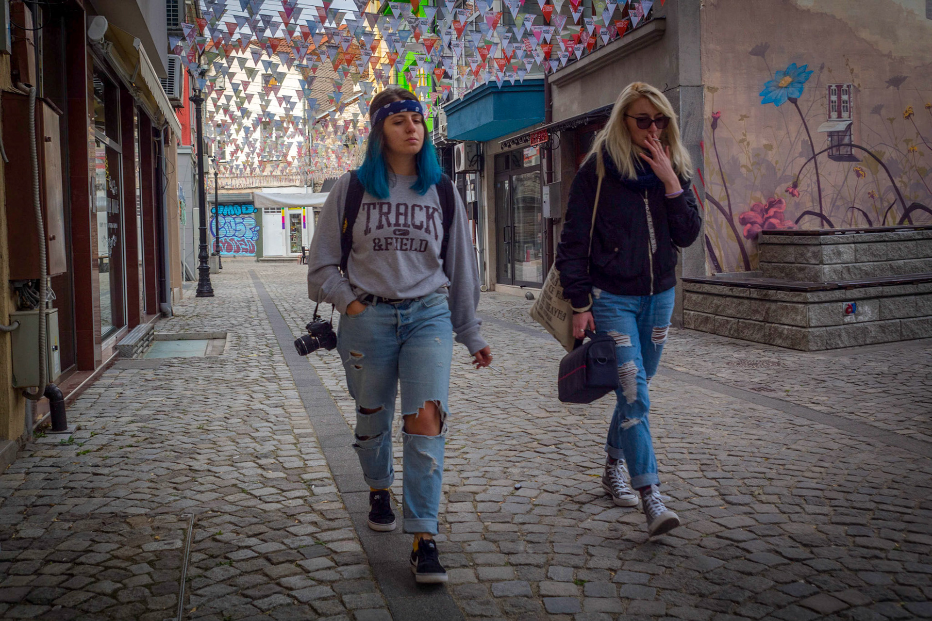 Two girls walking on the cobblestone streets of Kapana in Plovdiv, Bulgaria.