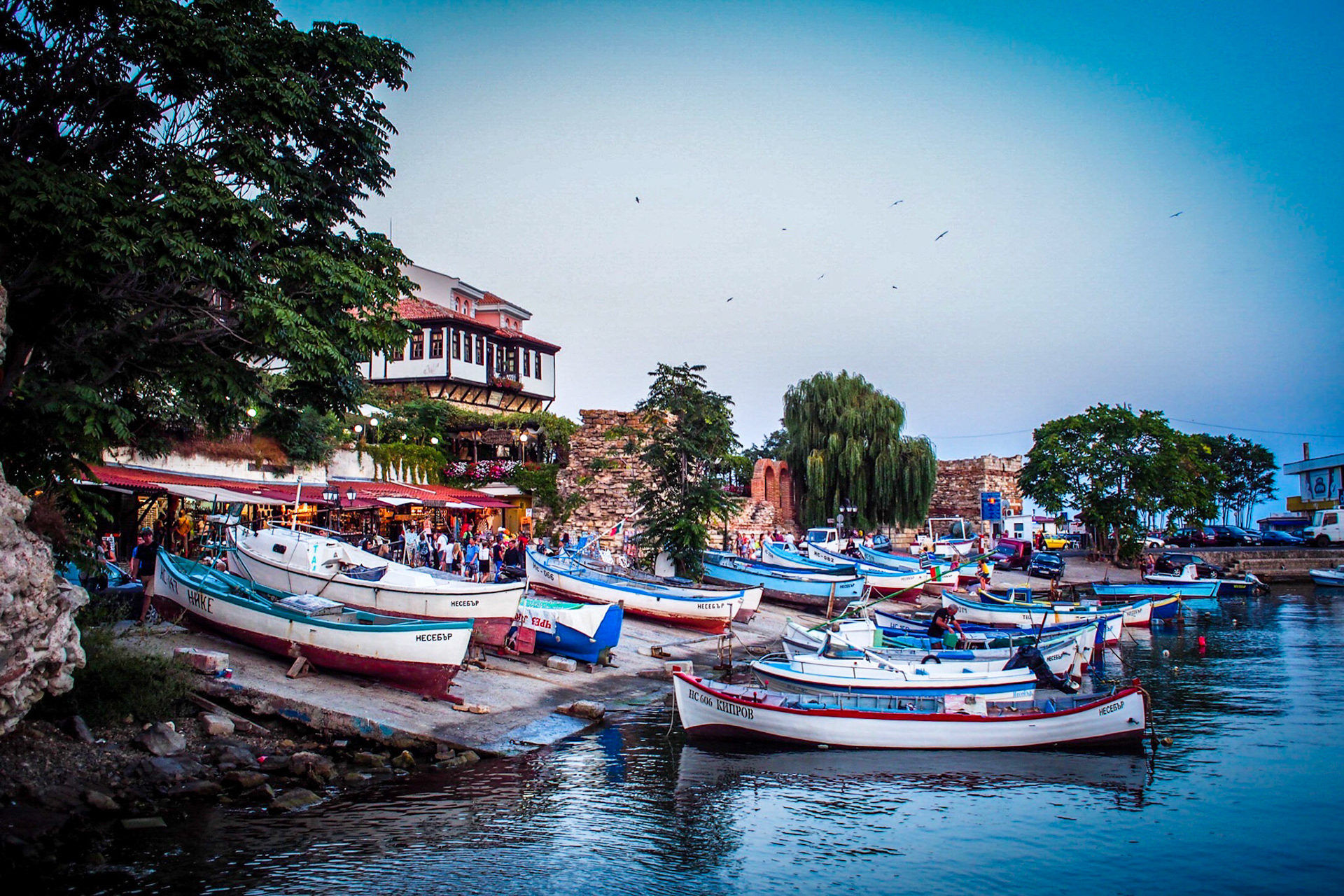 A collection of fishing boats moored in the harbour in the old town of Nessebar in Bulgaria.