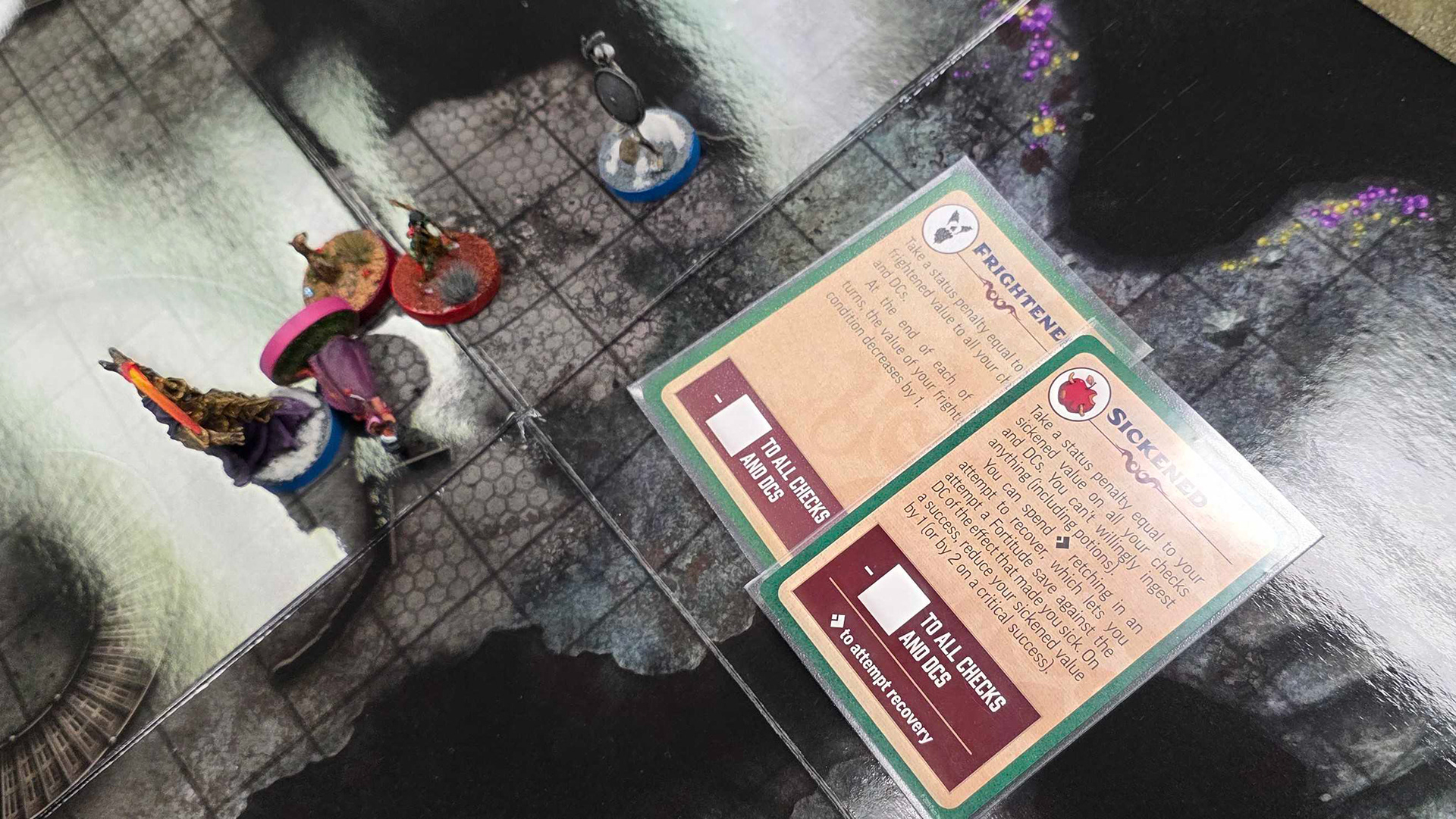 Those there are Pathfinder condition cards. They're worth a promotional boon that increases your level of success on a treat wounds check. 