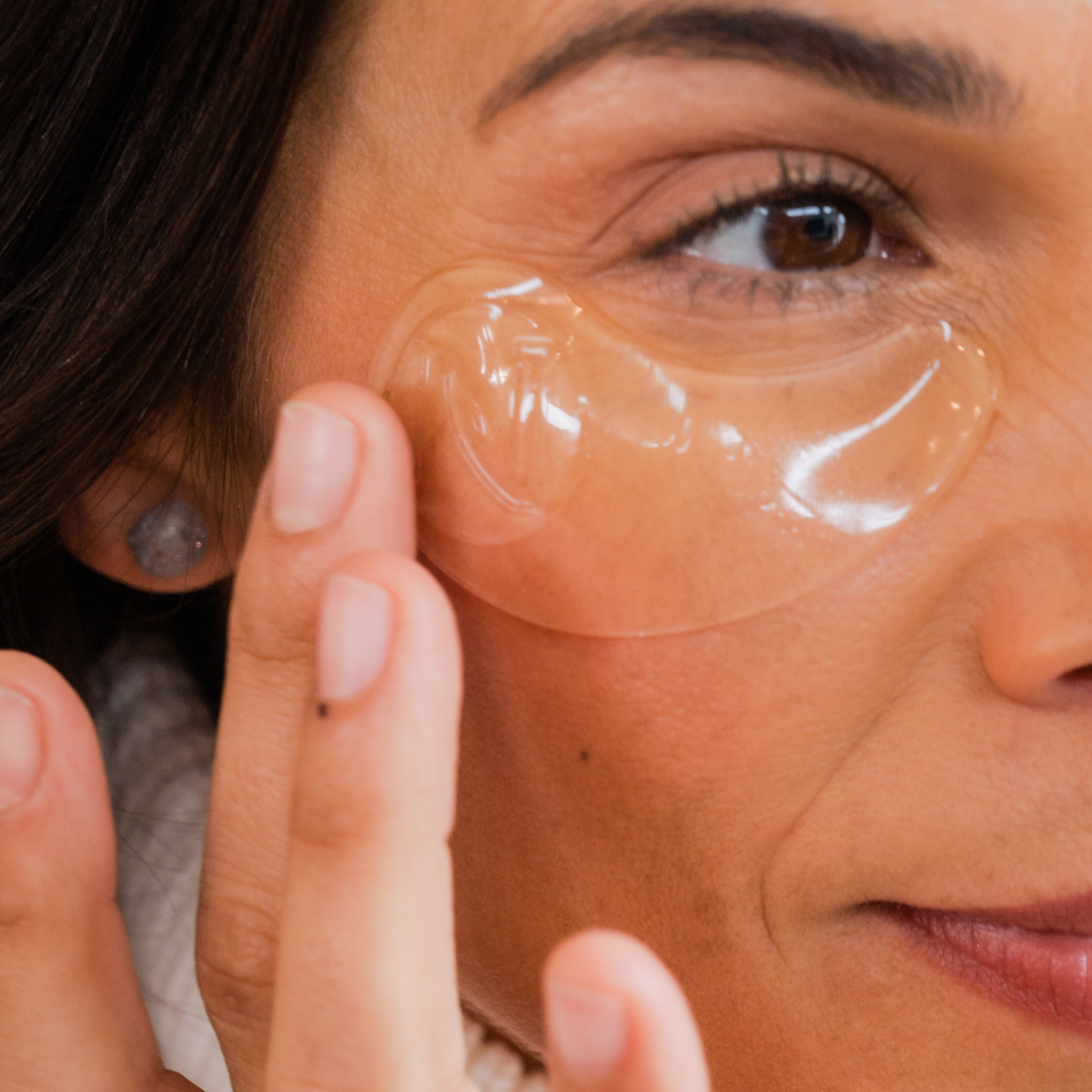 Close up shot of a woman applying underage patches
