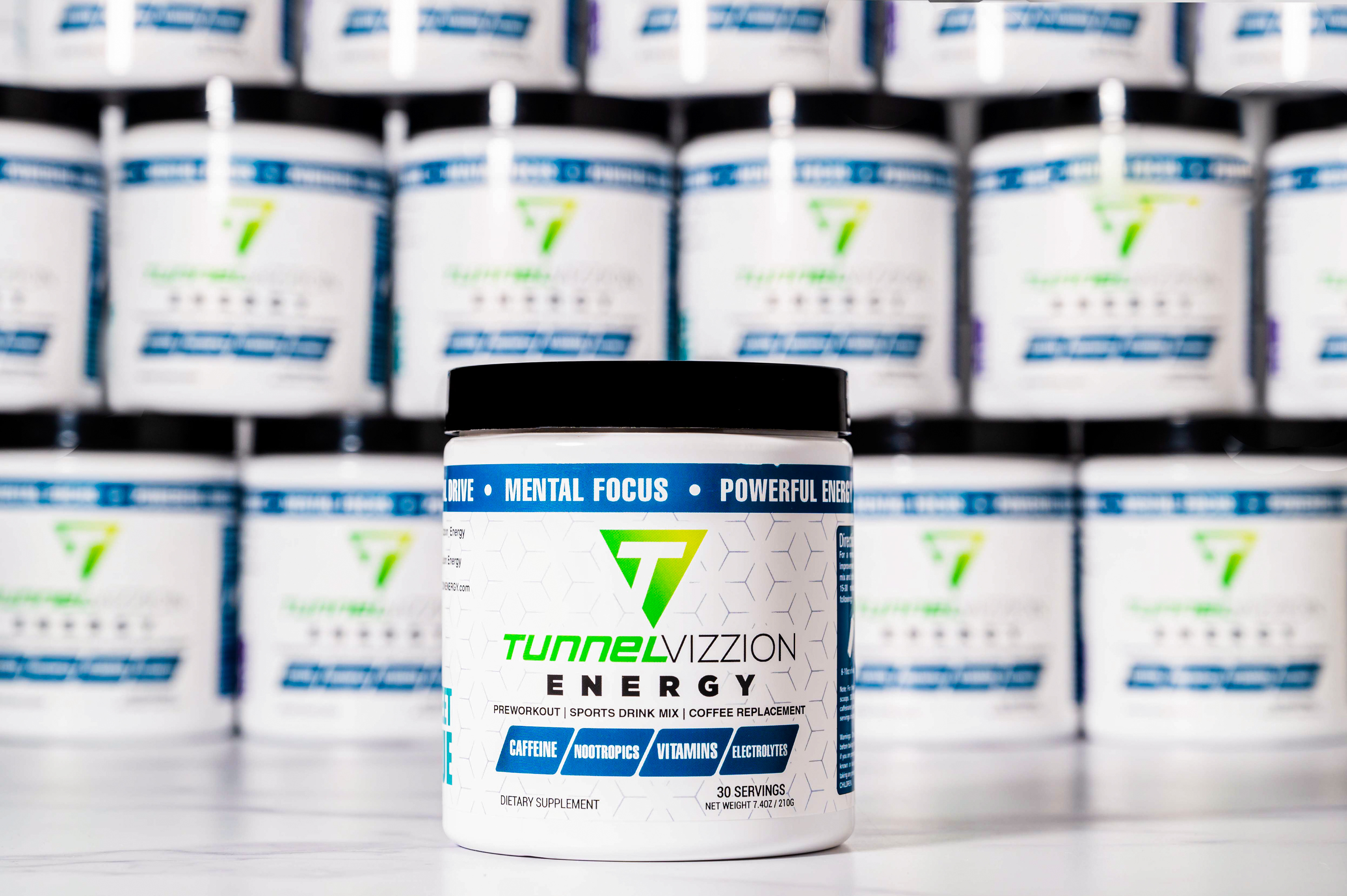 Hero image of Tunnel Vizzion Energy can with matching cans stacked behind it.