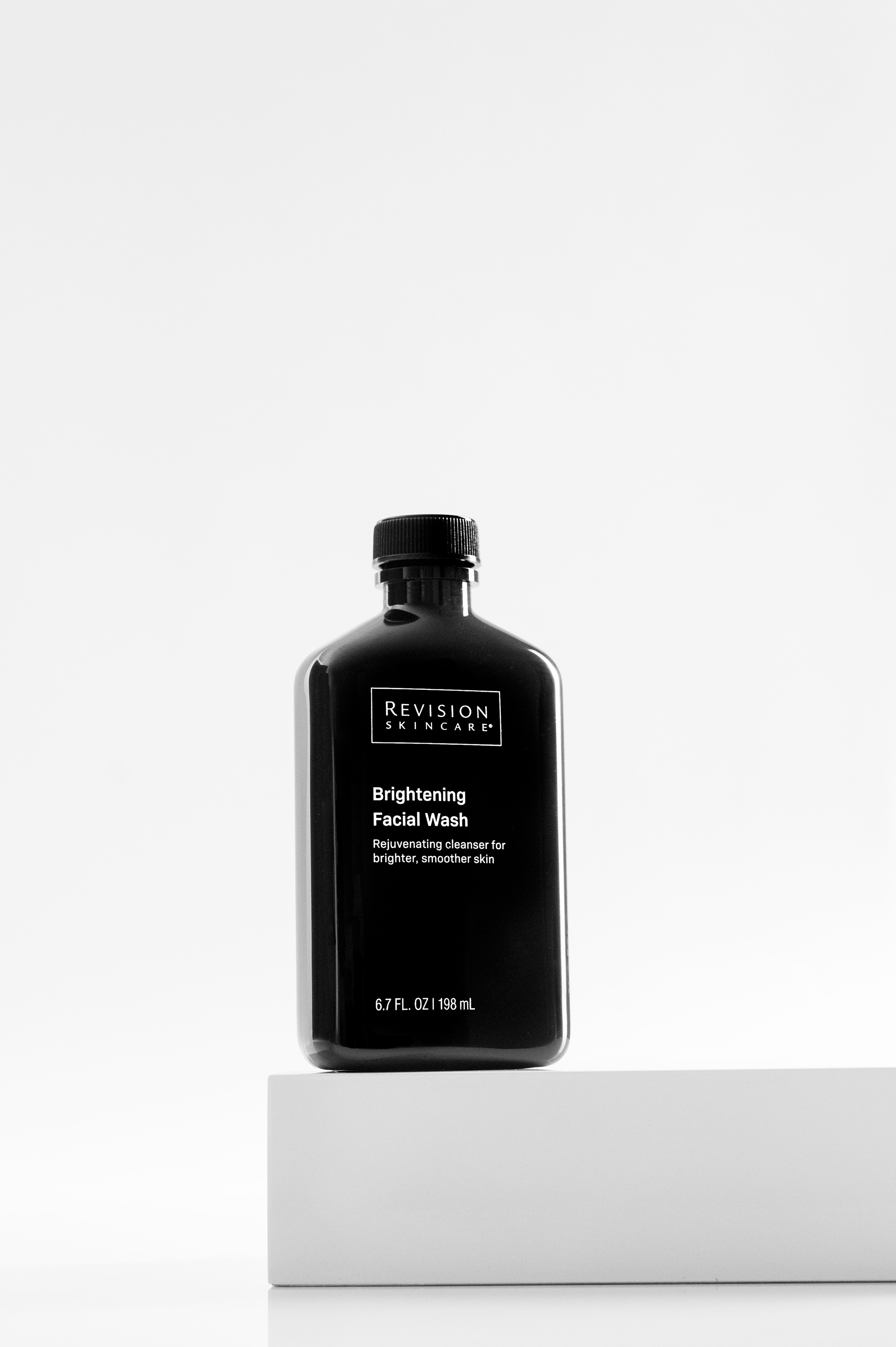 Black and white hero image of Revision Skincare Brightening Facial Wash