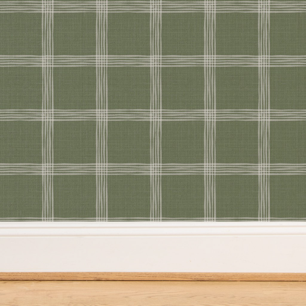 A modern take on plaid with textured white lines over a moss green background. Ideal for adding an organic and cozy structure.