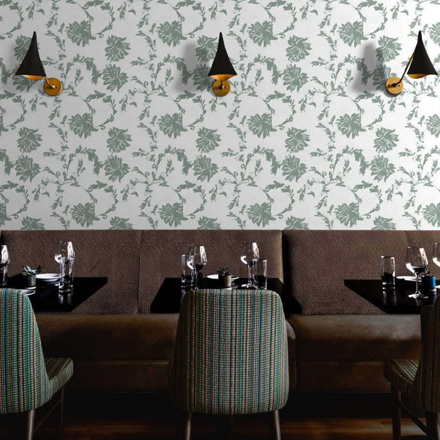 A floral pattern featuring loose, artistic ink strokes that evoke the fluidity of a freehand sketch. The sage green hue on an off-white background lends organic freshness and a modern dynamism to classic botanical forms.