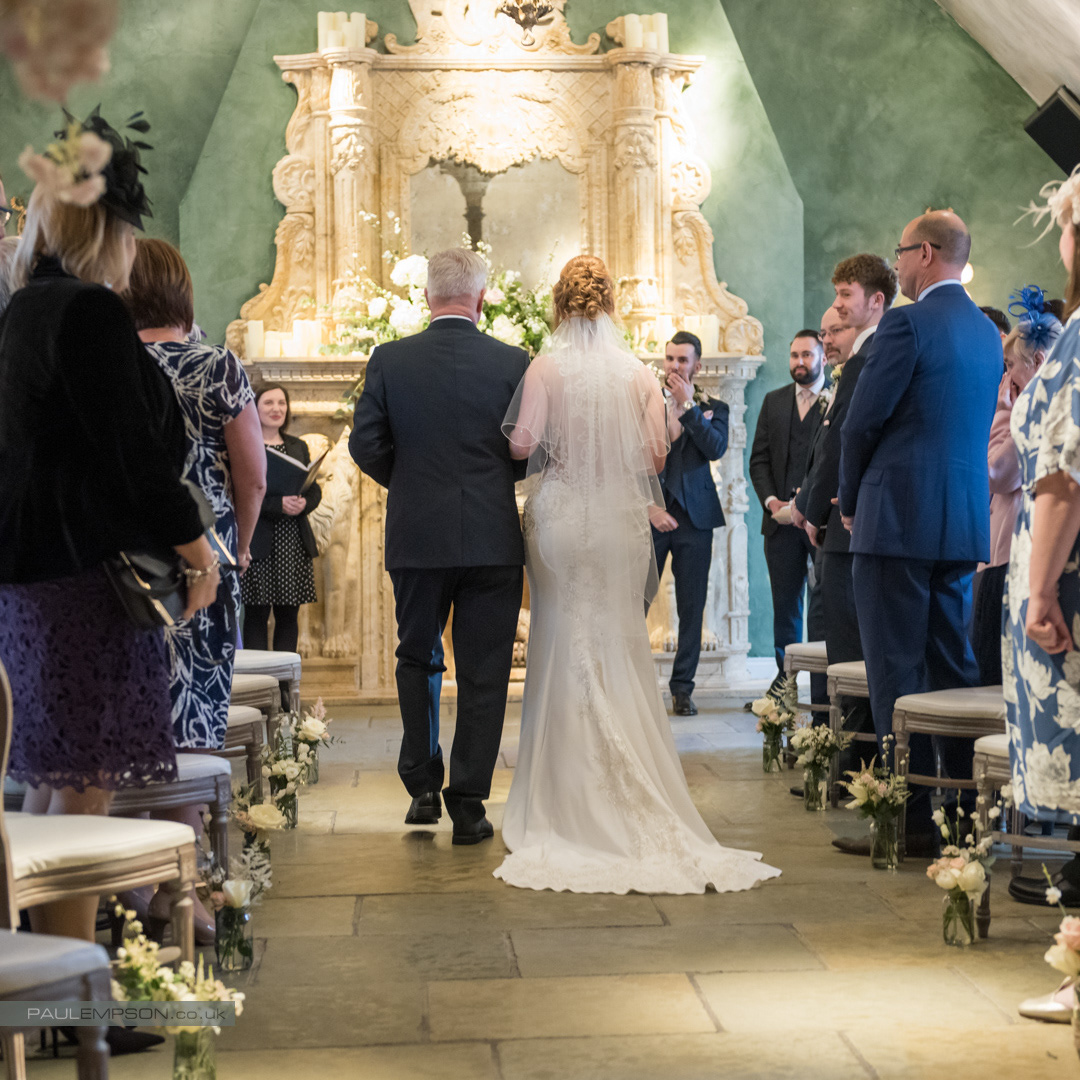 Le Petit Chateau wedding groom gasps as he sees his bride walk down the aisle