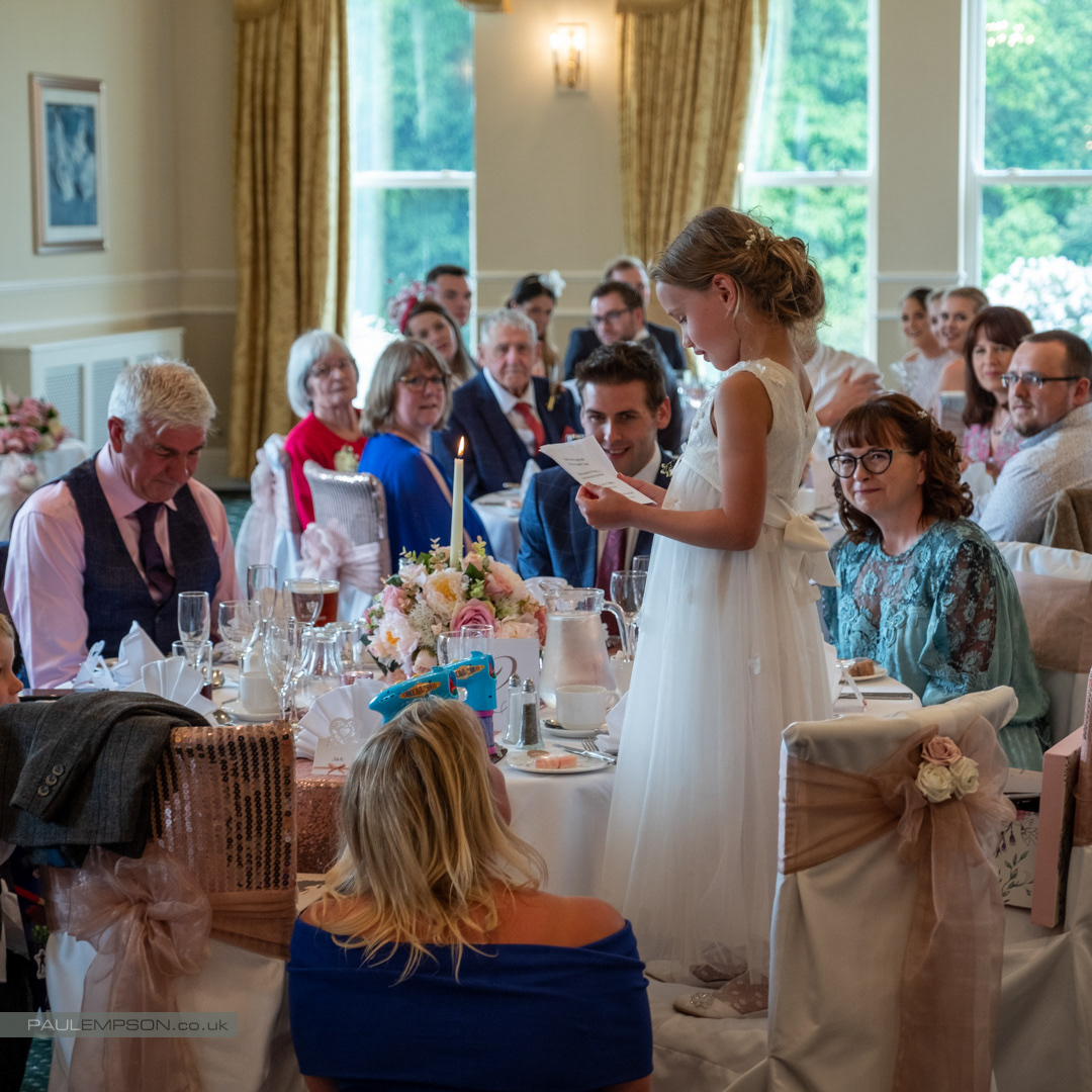 Grinkle Park wedding flower girl reads to the room