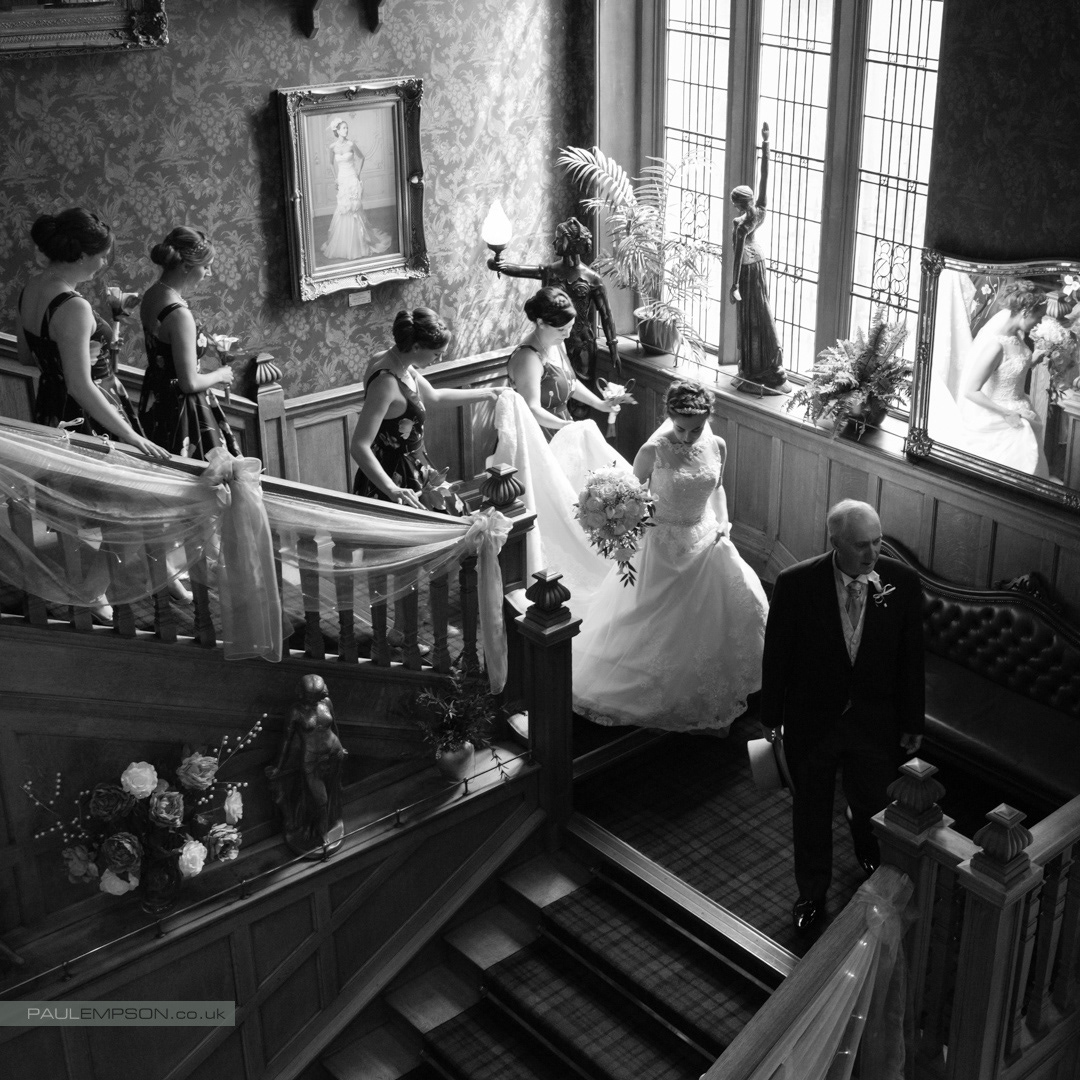 Rushpool Hall Wedding Father & Bride descend the stairs with Bridesmaids