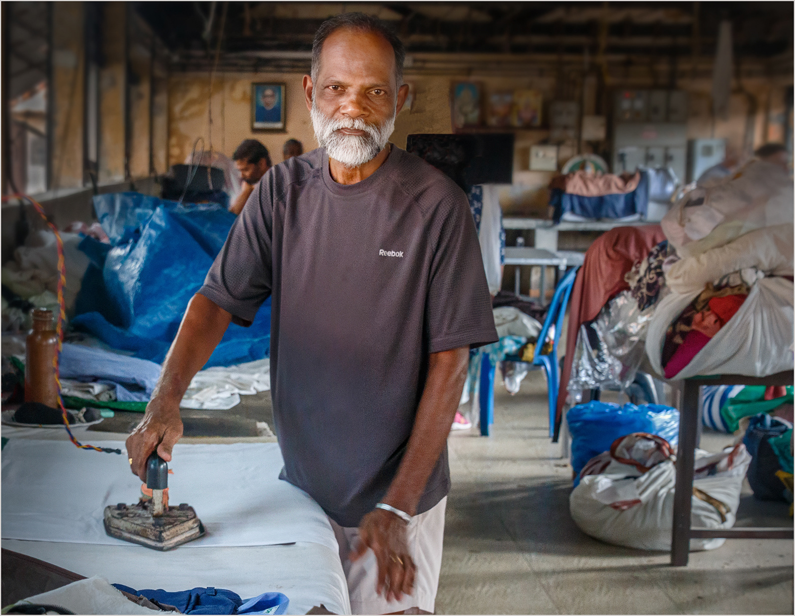 2nd : "Ironing Duties at the Dhobi Ghat" by Roy Peters