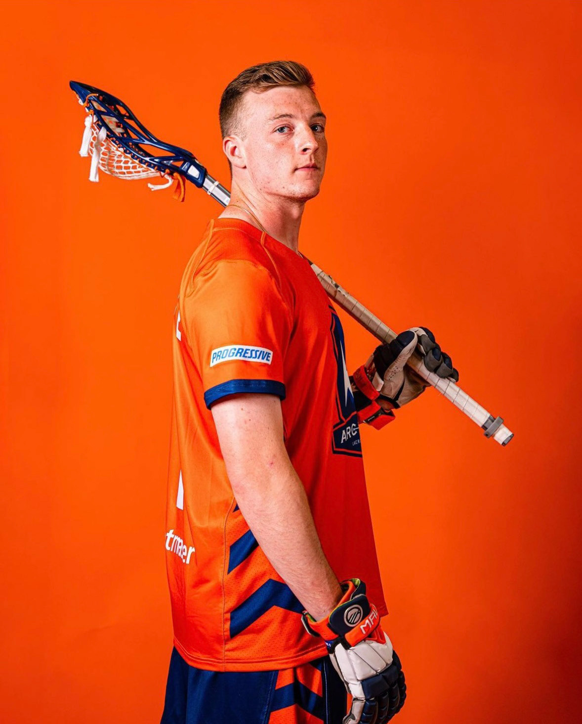 Side view of jersey on body with on field accessories.