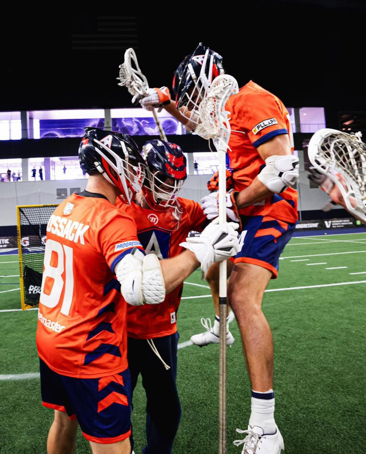 Action shot of team during season wearing main orange jersey