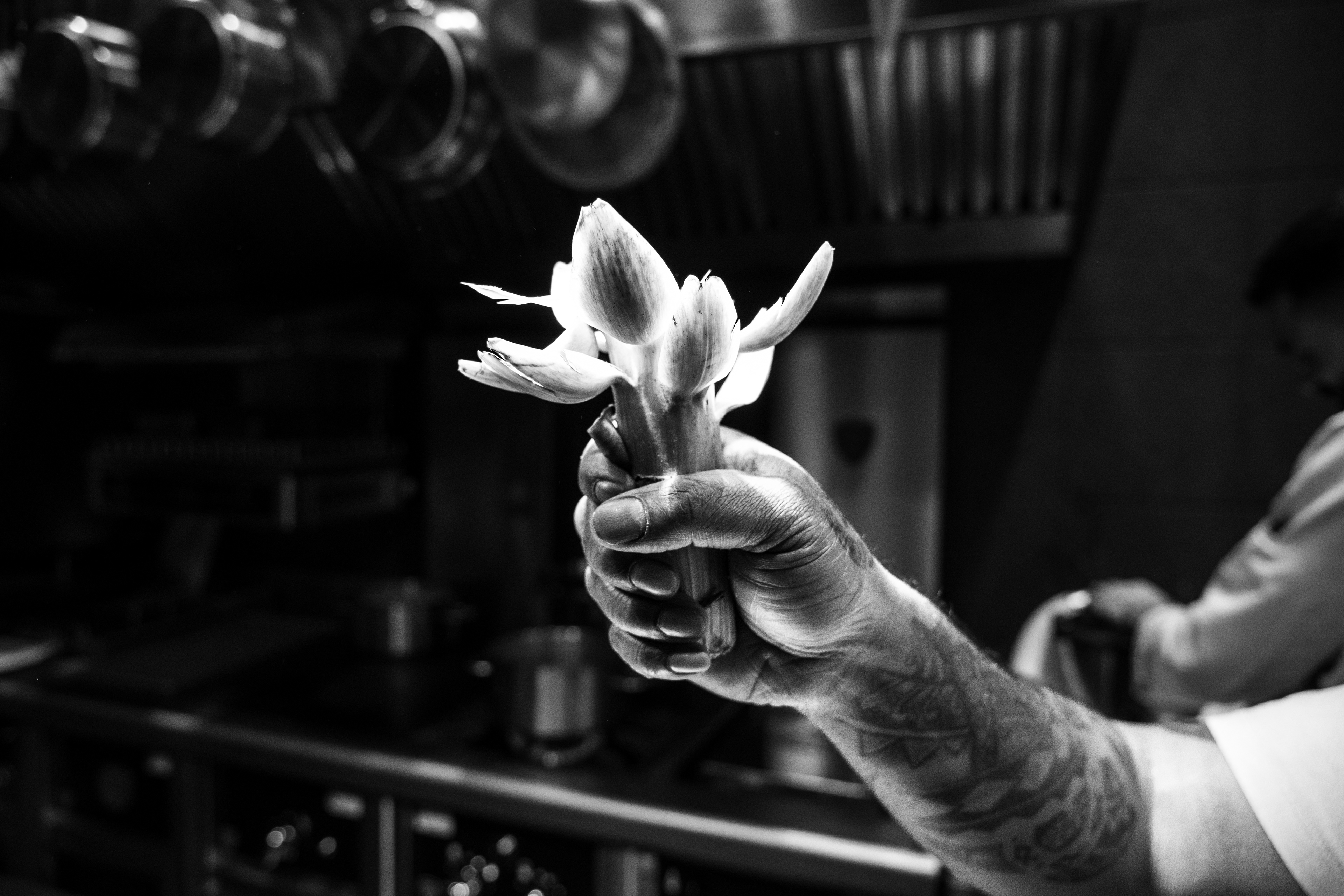 At Mantra restaurant, chef Manogeran Shasitharan holds an artichoke intended for the fourth course of the menu, on 24 March 2026, in Paris (9th arrondissement), France.