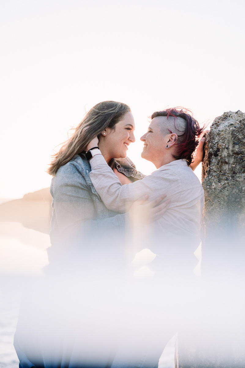 Romantic portrait of two women looking lovingly at each other.
