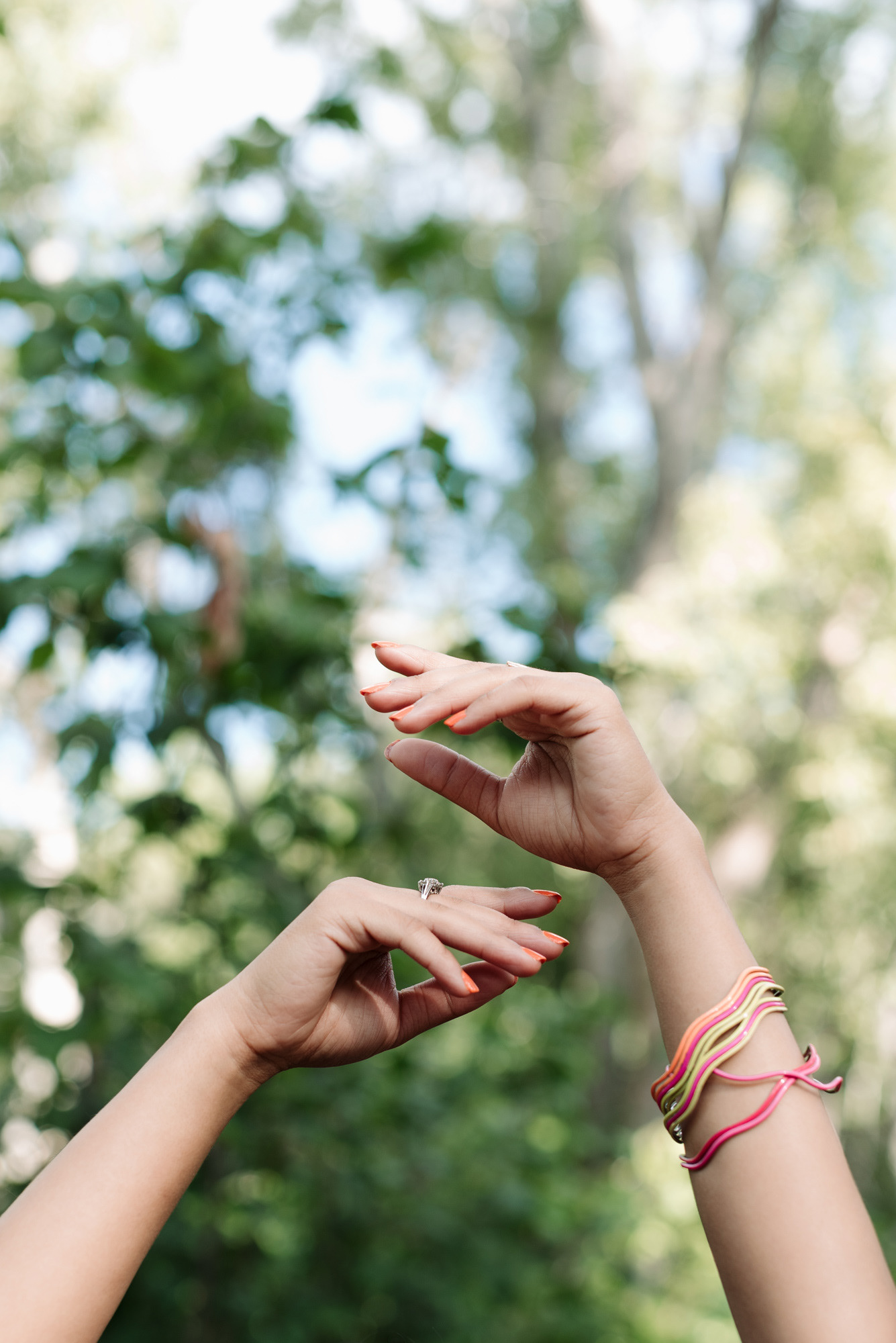 Woman's hands in the air like a ballerina.