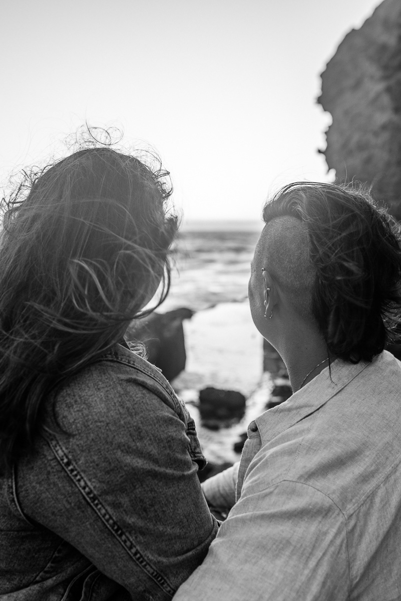 Portrait of two women looking out to sea.