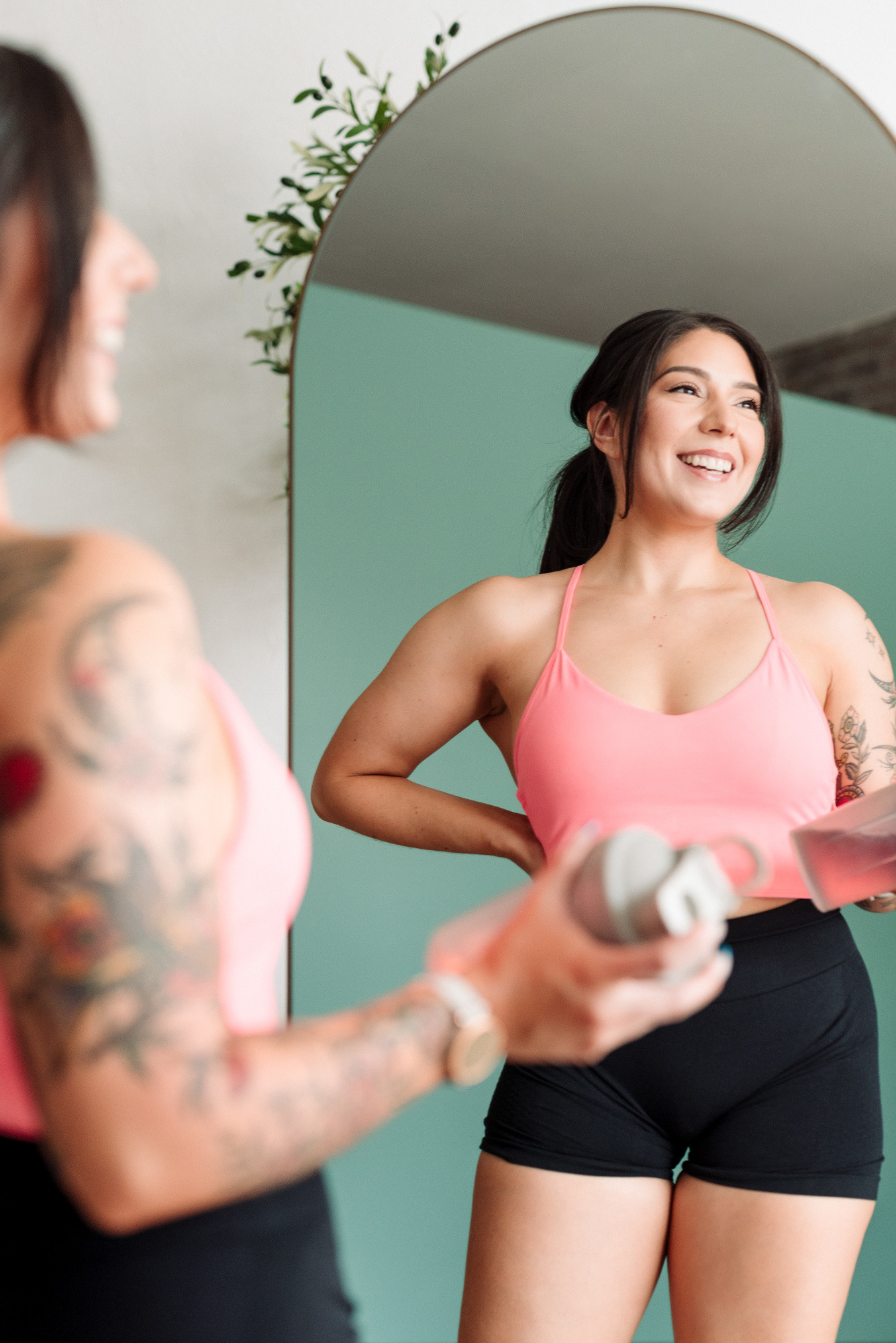 Personal branding portrait of a personal trainer reflected in a mirror.