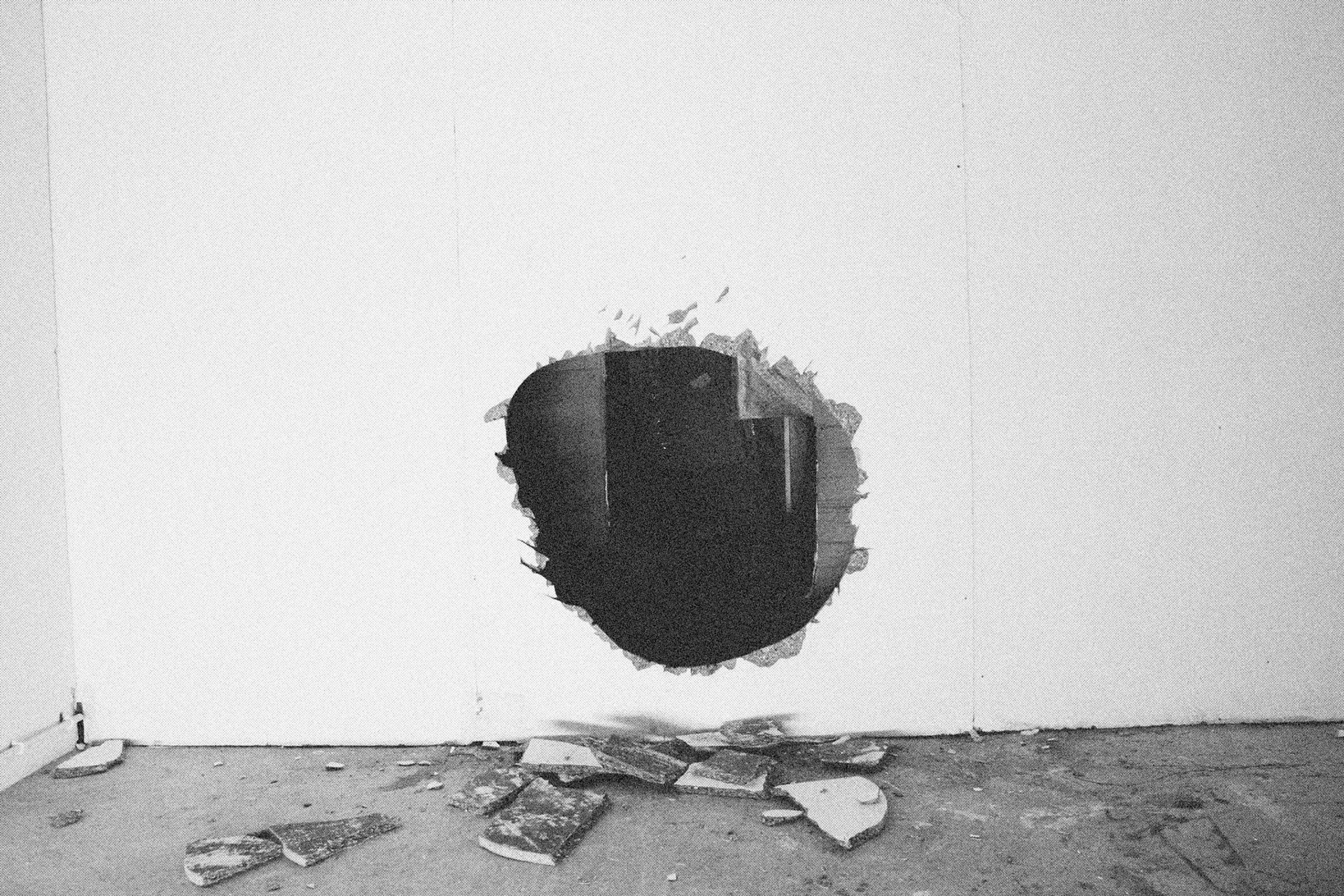 Reconstructed Constructioninstallationcardboard on wooden construction, silk screened wallpaper, tiled floor, carpet floor, electrical equipment: television, DVD-player, transmitter, lightning, plastic ridge tent, silkscreen materials, copy prints, iron case, bed mattress, buckets of latex paint.2006