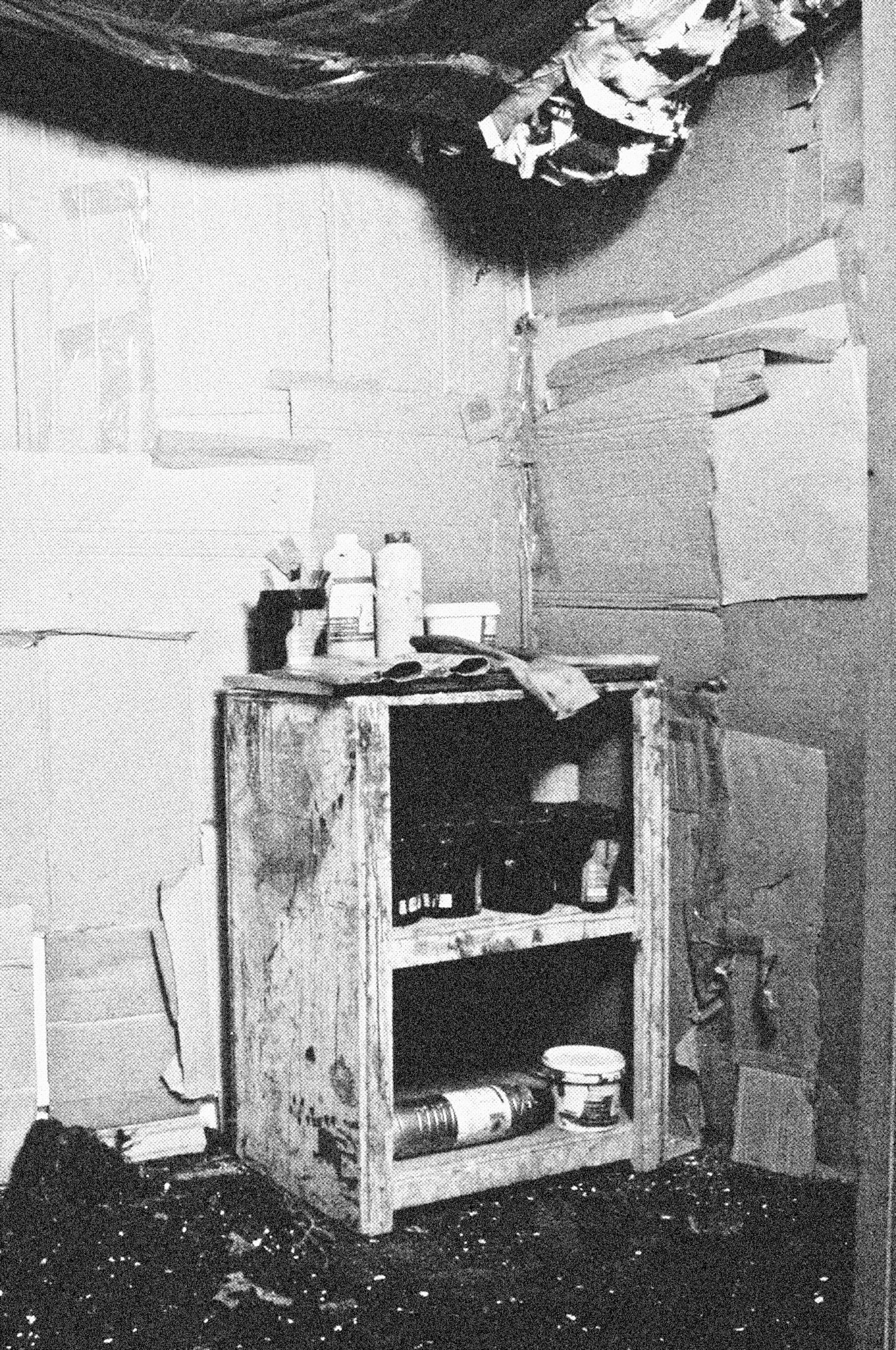 Reconstructed Constructioninstallationcardboard on wooden construction, silk screened wallpaper, tiled floor, carpet floor, electrical equipment: television, DVD-player, transmitter, lightning, plastic ridge tent, silkscreen materials, copy prints, iron case, bed mattress, buckets of latex paint.2006