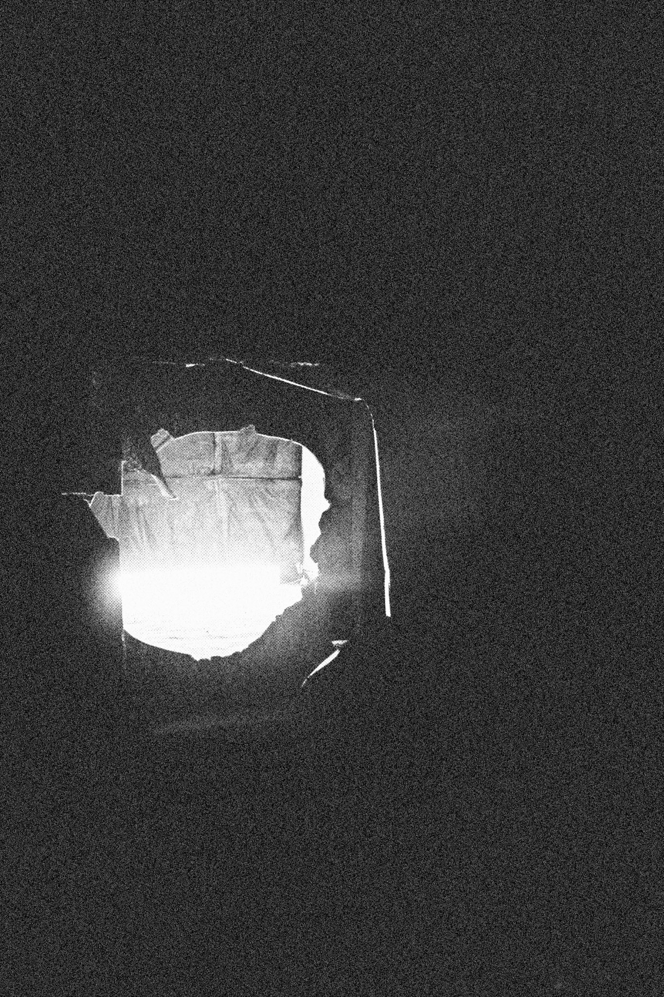 Reconstructed Constructioninstallationcardboard on wooden construction, silk screened wallpaper, tiled floor, carpet floor, electrical equipment: television, DVD-player, transmitter, lightning, plastic ridge tent, silkscreen materials, copy prints, iron case, bed mattress, buckets of latex paint.2006