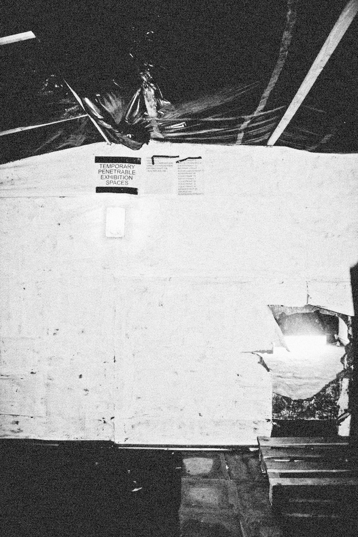 Reconstructed Constructioninstallationcardboard on wooden construction, silk screened wallpaper, tiled floor, carpet floor, electrical equipment: television, DVD-player, transmitter, lightning, plastic ridge tent, silkscreen materials, copy prints, iron case, bed mattress, buckets of latex paint.2006