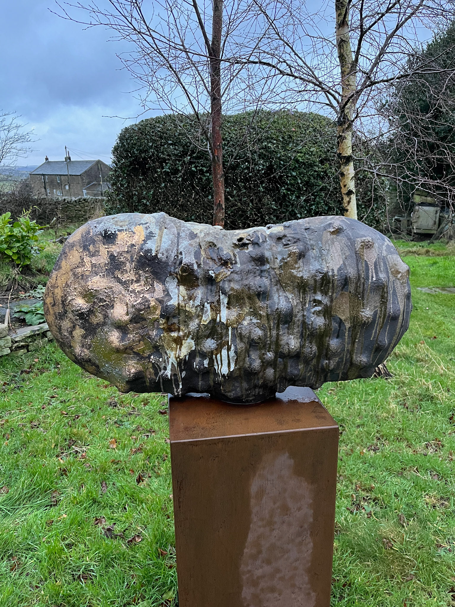 One of Tim's pieces in his studio garden, next to the smoke-fired kiln.