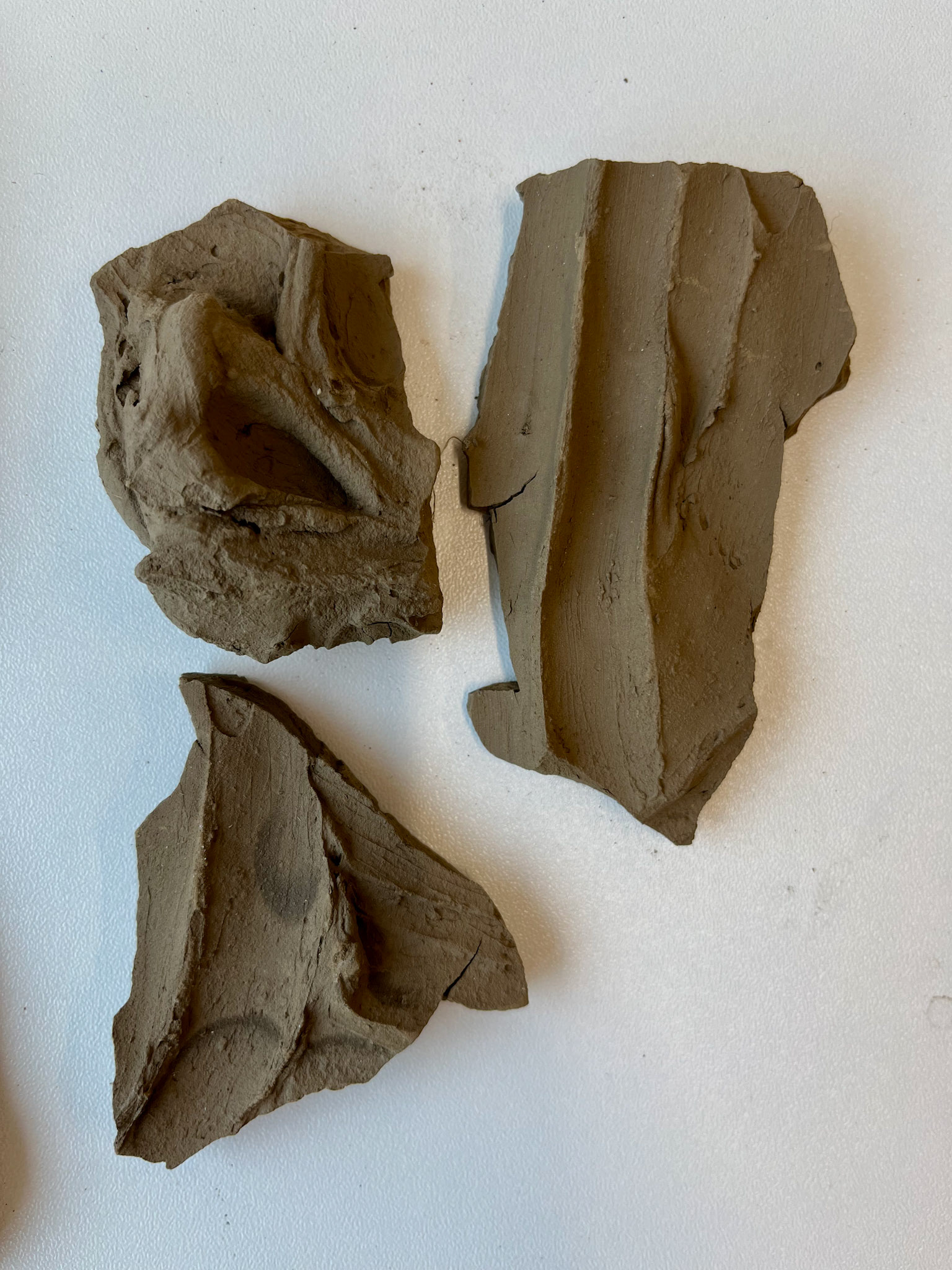 Unfired, textured pieces