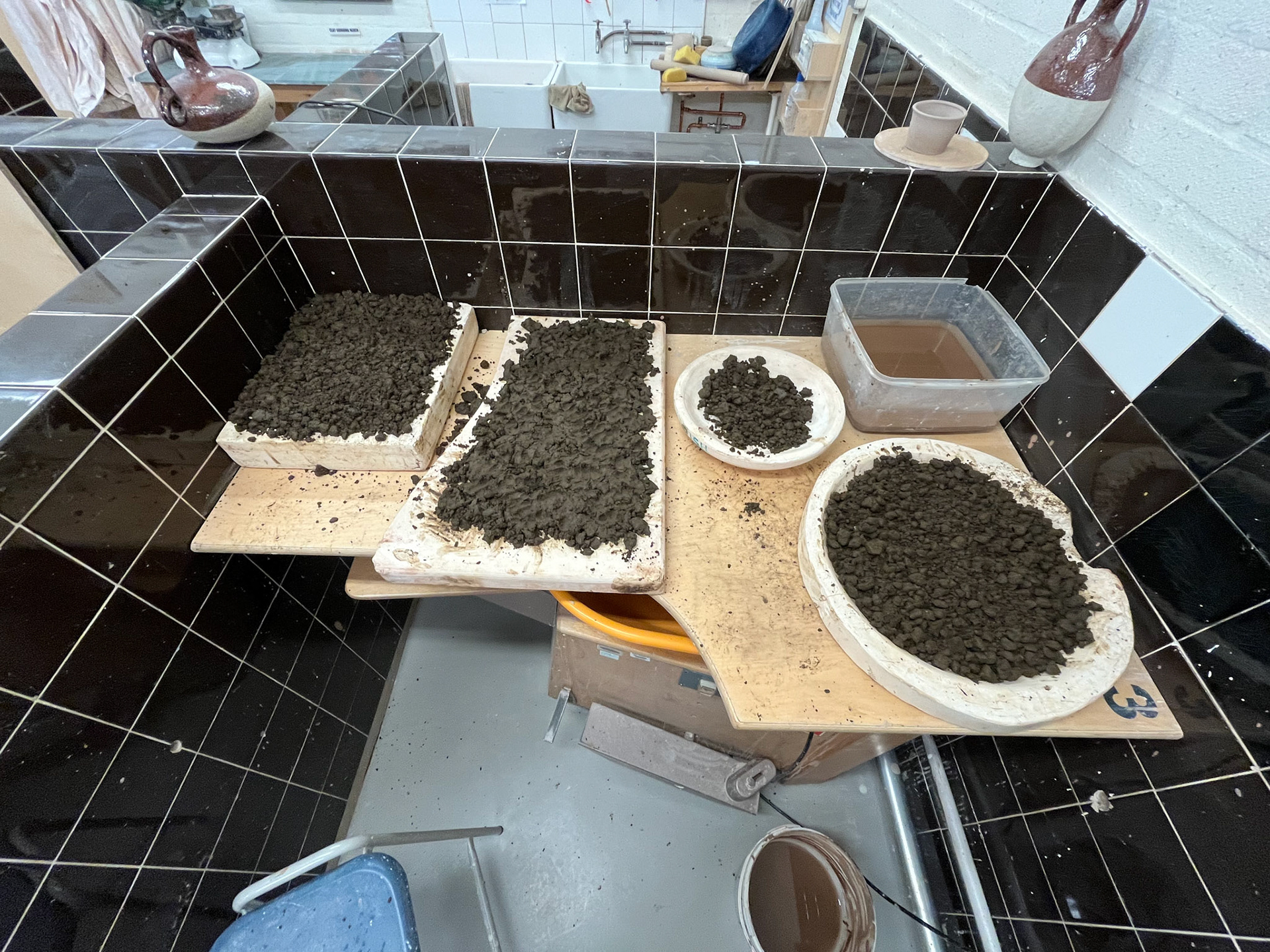 Laying out clay to settle