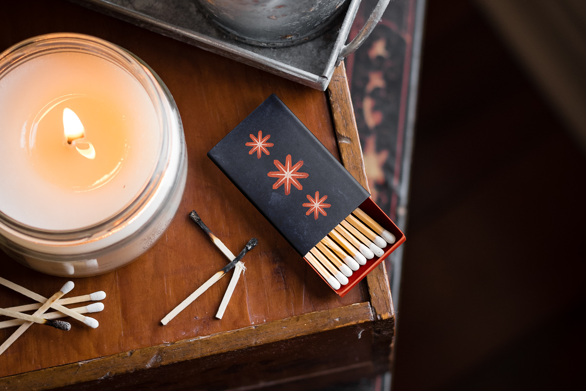 A matchbox featuring the brand icon