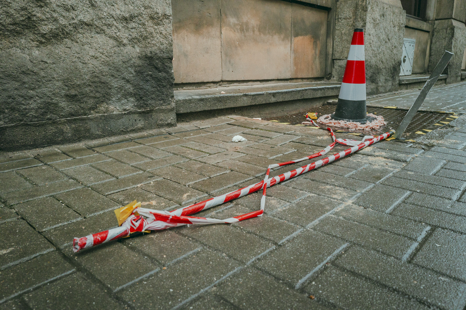 Construction tape and traffic cone in the street, from the project Urban Anatomy