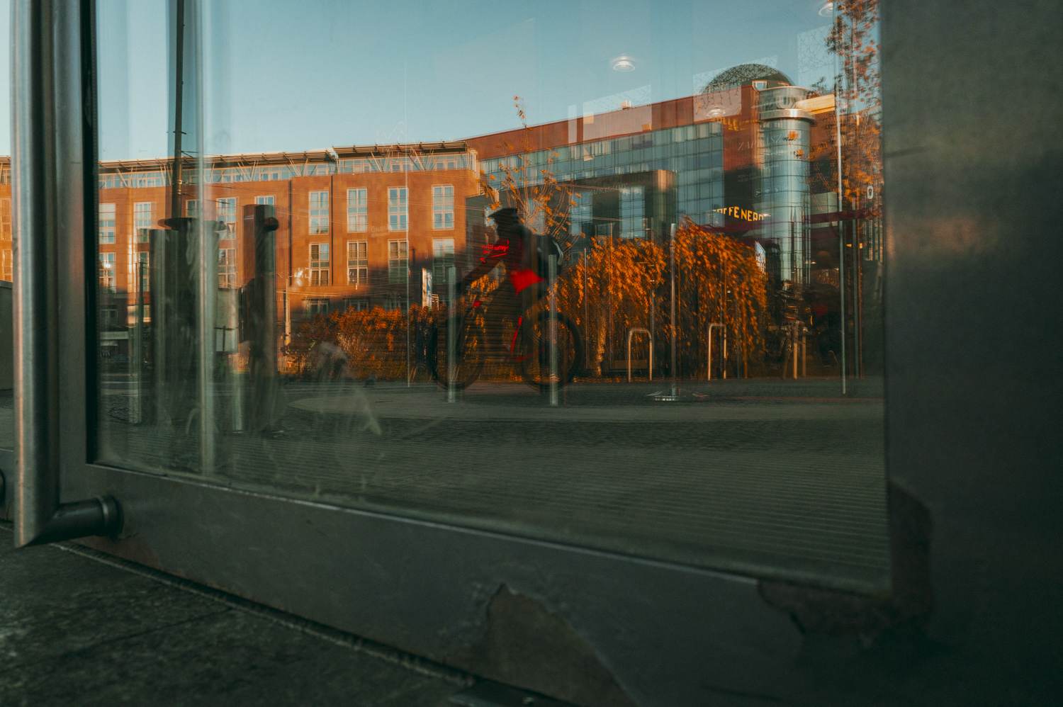 Reflections of people in a shop window, from the project Urban Anatomy