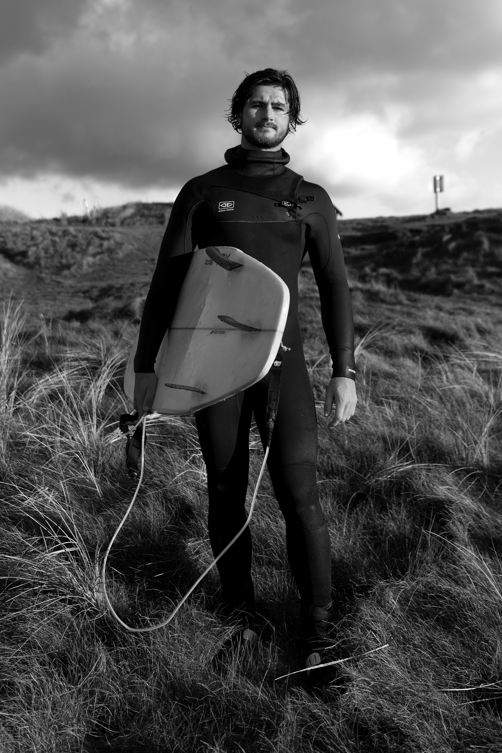 Liam Ross, an intermediate surfer on the sand dunes of Gwithian Towans Beach,  Hayle, Cornwall, UK 30/11/2022 © Simon Shea 2022