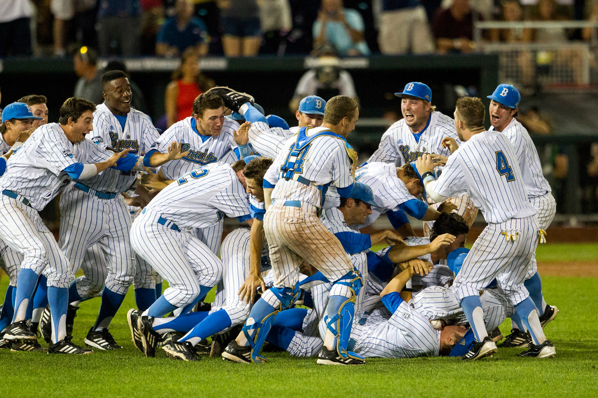 UCLA players dogpile celebration after defeating the Mississippi State Bulldogs in the Finals of the College World Series on June 25, 2013 at TD Ameritrade Park in Omaha, Nebraska. The Bruins defeated the Bulldogs 8-0, winning the National Championship. (Andrew Woolley/Four Seam Images)

