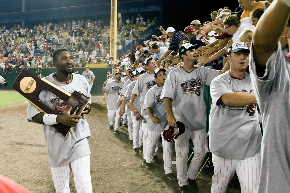 South Carolina CF Jackie Bradley Jr carries the championship trophy following NCAA Division One Men's College World Series Finals on June 29th, 2010 at Johnny Rosenblatt Stadium in Omaha, Nebraska.  (Photo by Andrew Woolley / Four Seam Images)