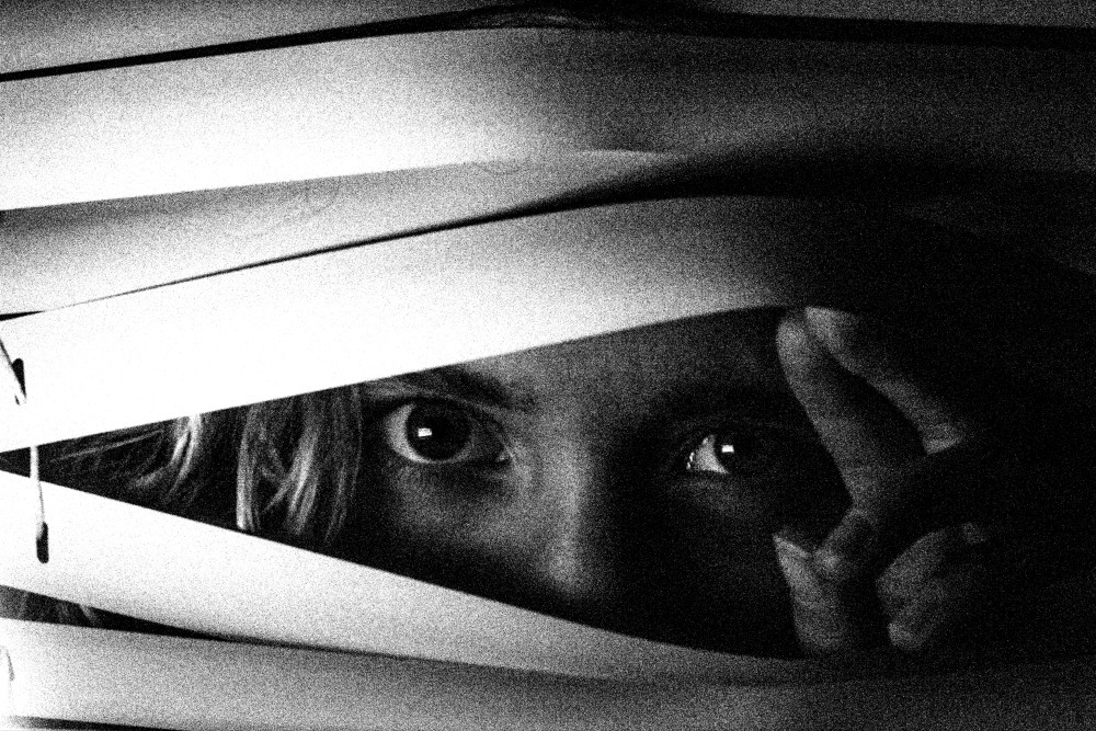 "Fear" - The title of the photo essay and an invitation for the viewer to peer through it. © Elizabeth Frone