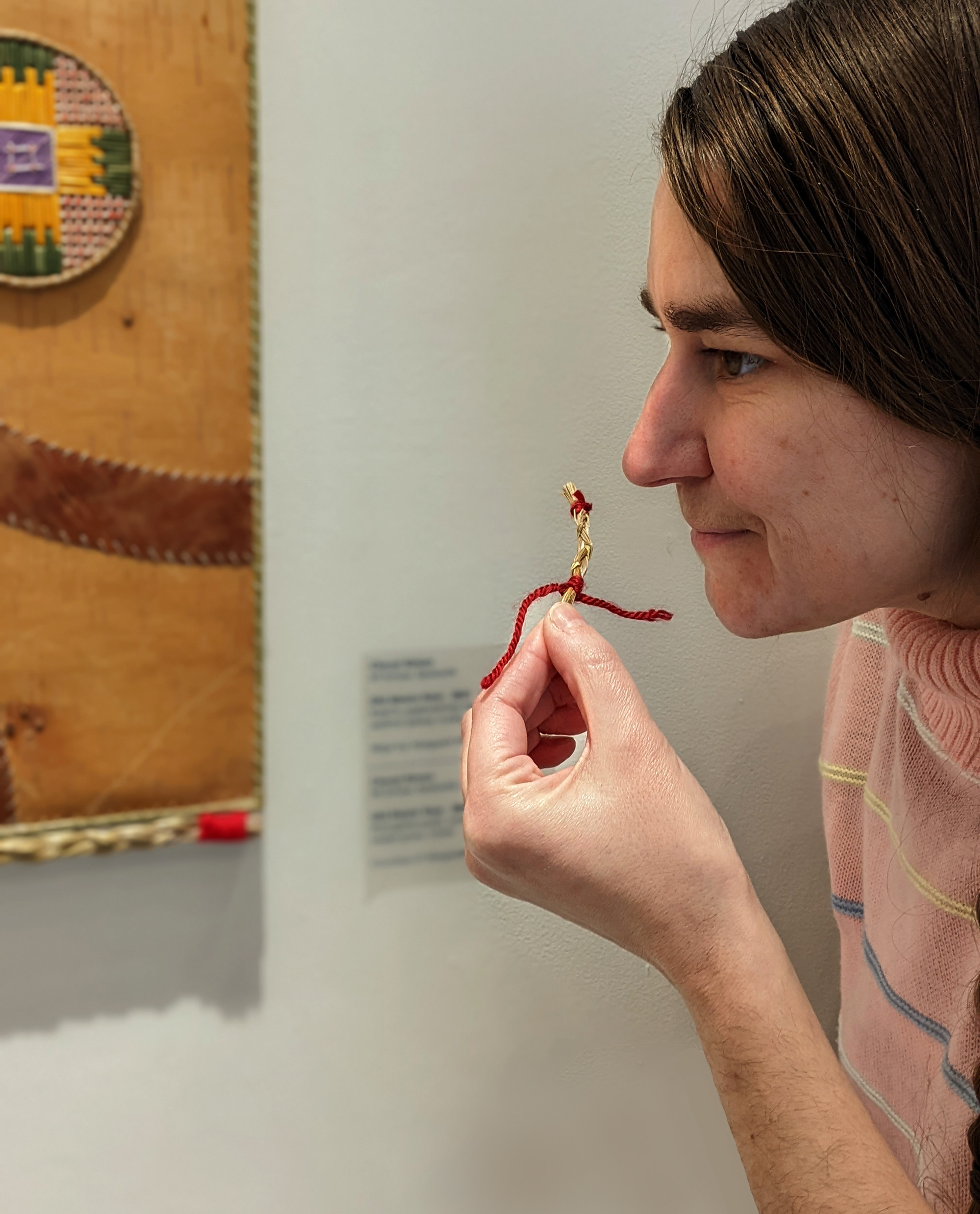 Visitor smelling sweetgrass