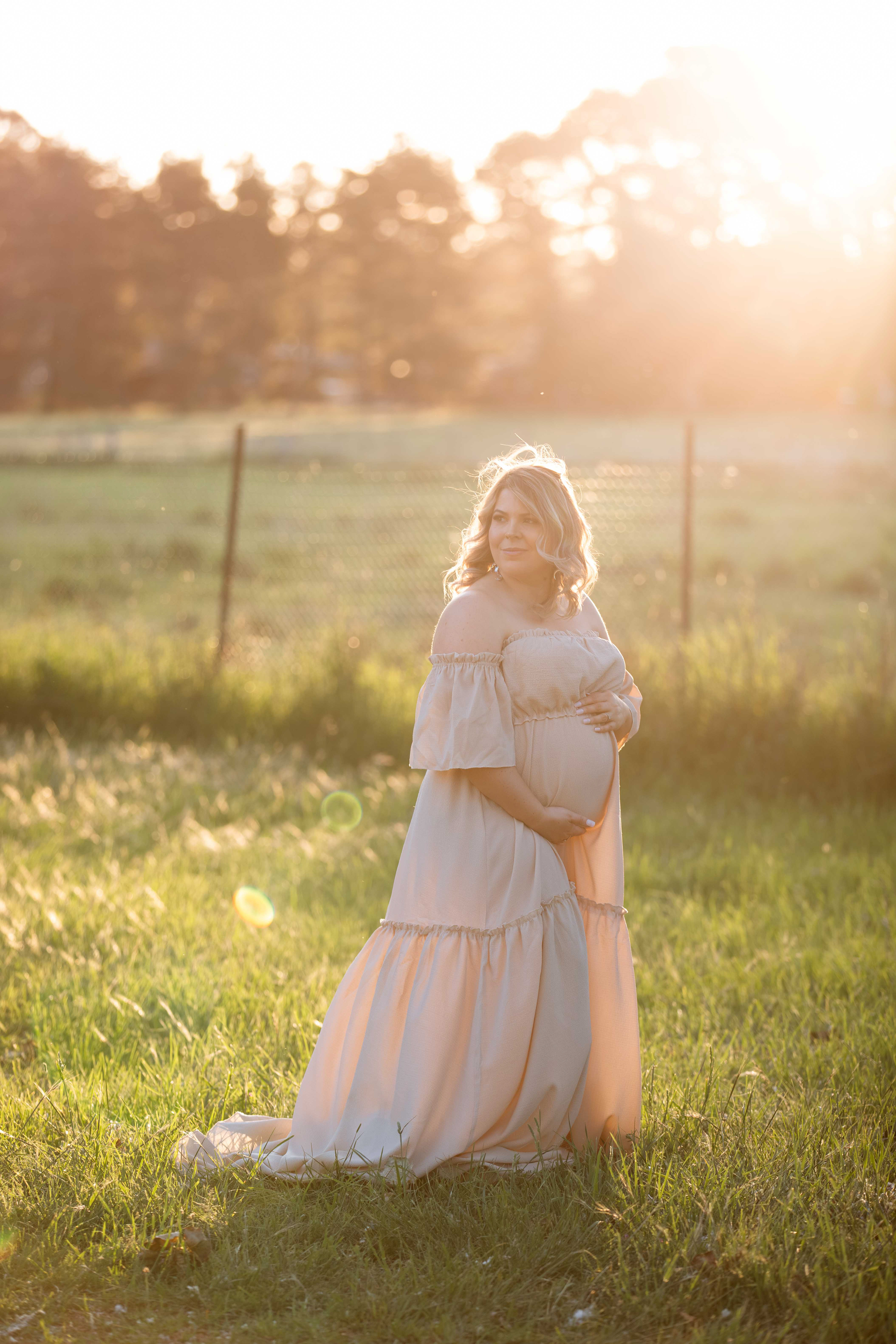 Beautiful outdoor maternity photoshoot in Canberra featuring an expecting mother, captured by professional photographer Olia Photography, specializing in pregnancy and newborn photography, creating timeless and natural portraits for moms-to-be.
