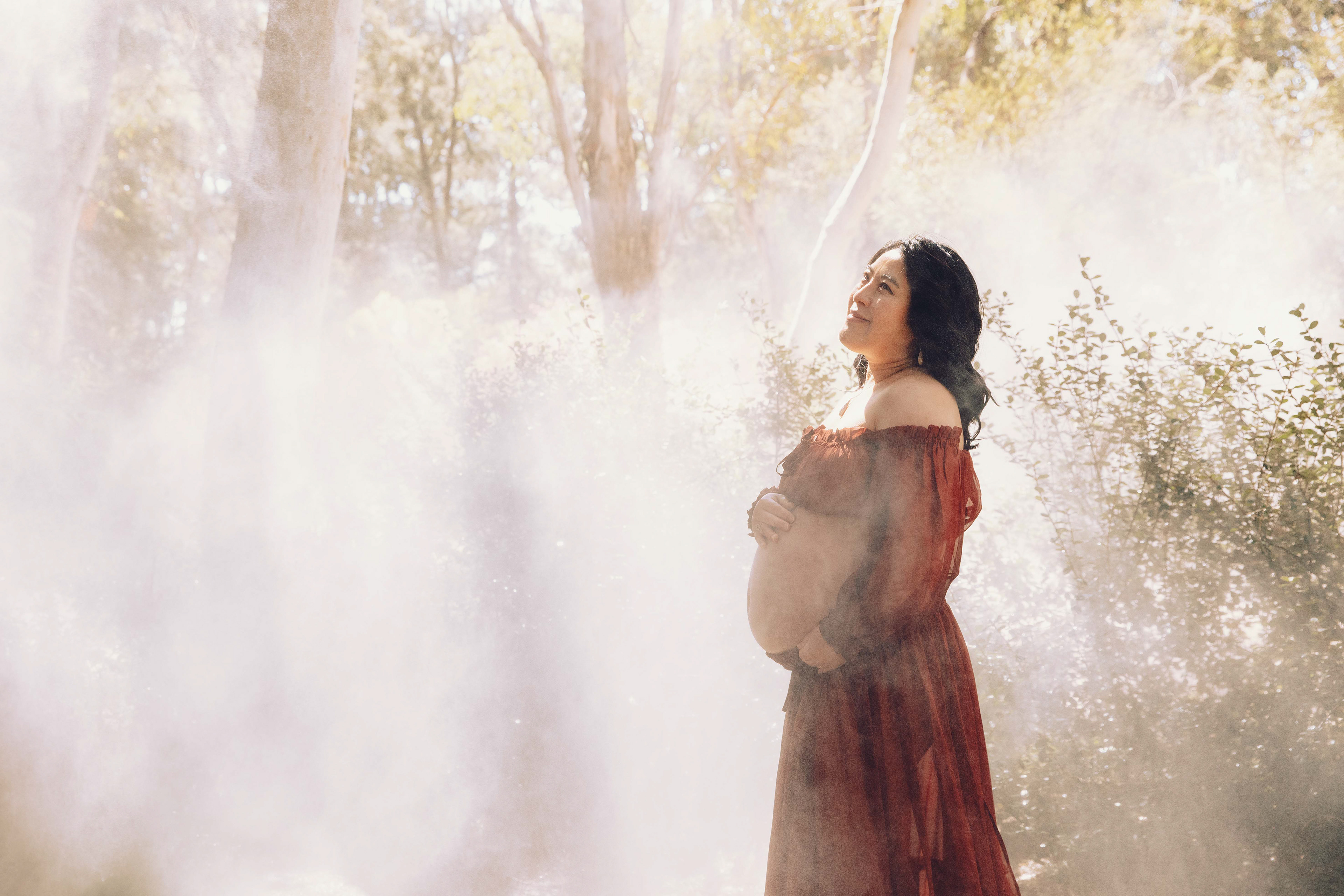 Beautiful outdoor maternity photoshoot in Canberra featuring an expecting mother, captured by professional photographer Olia Photography, specializing in pregnancy and newborn photography, creating timeless and natural portraits for moms-to-be.