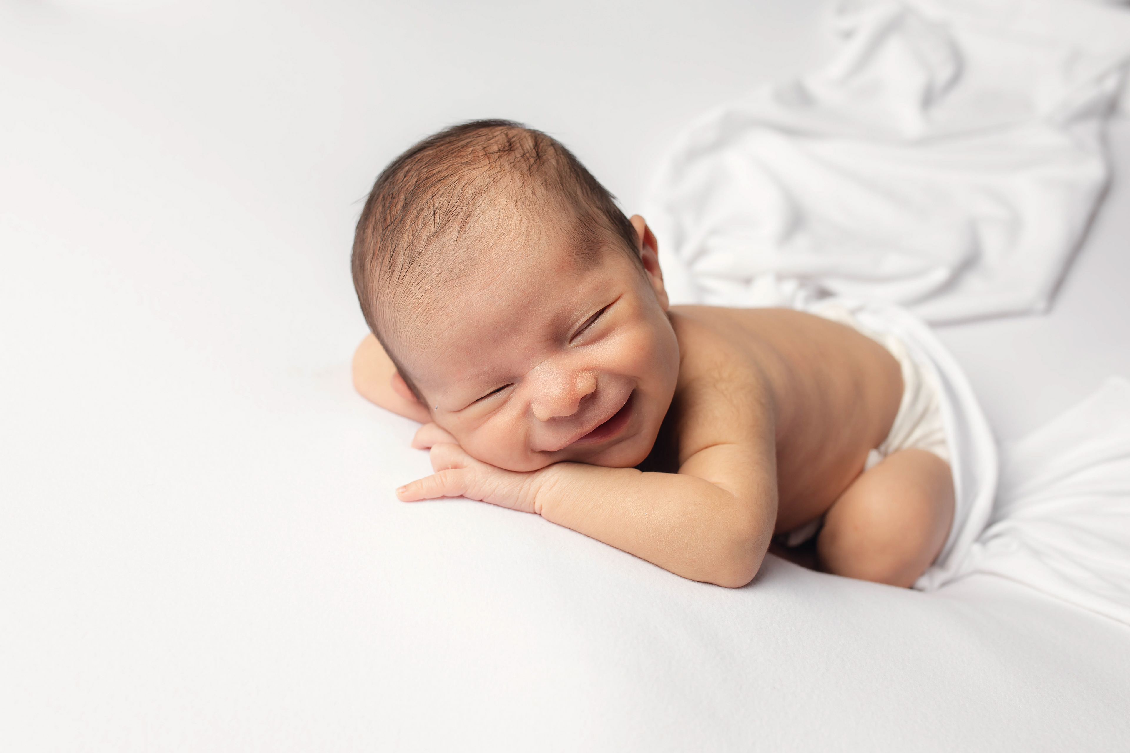 Newborn baby portrait session in Canberra captured by Olia Photography, specializing in professional maternity, newborn, and family photography.