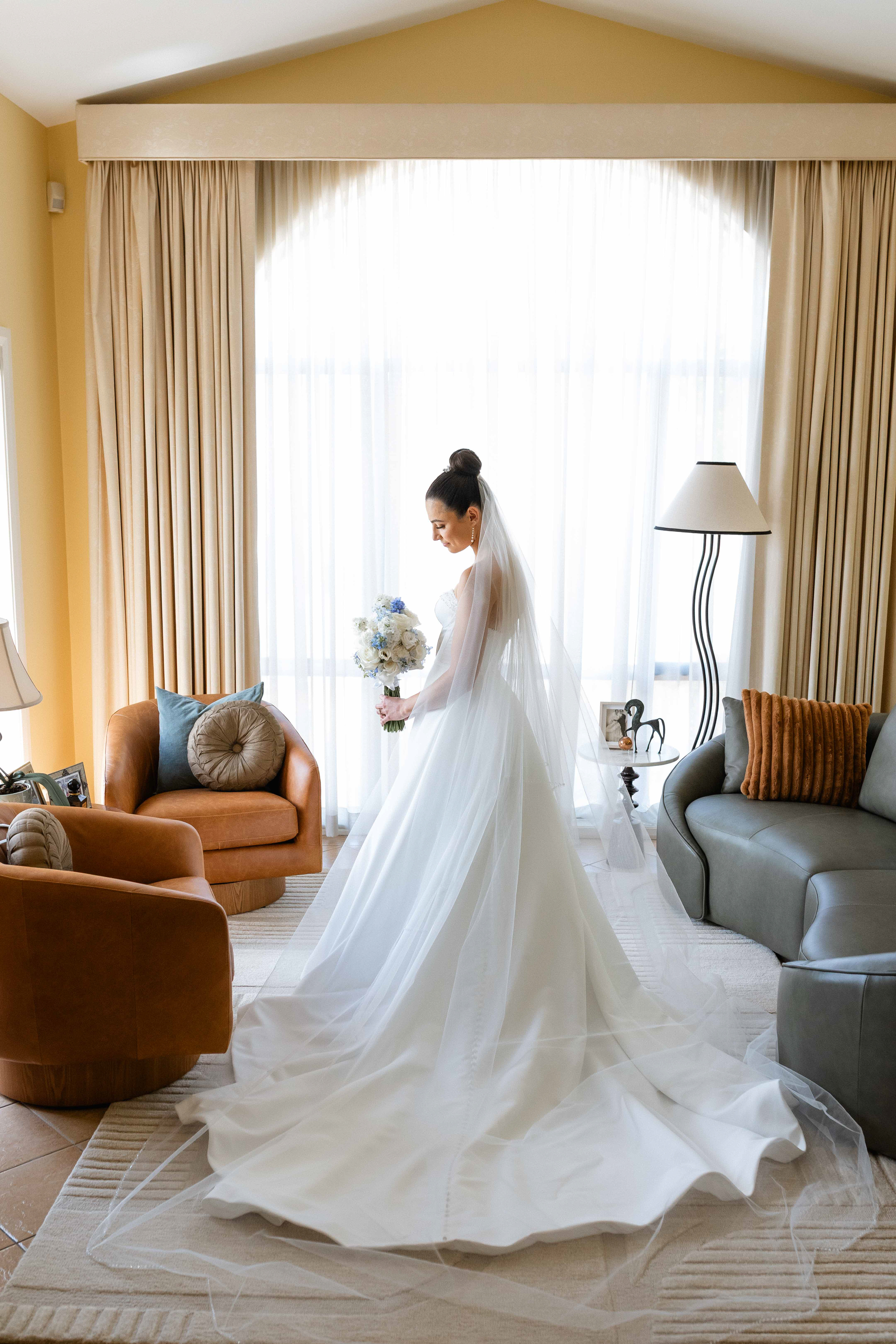 Bride getting ready on her wedding day. Captured by Olia Photography in Canberra.