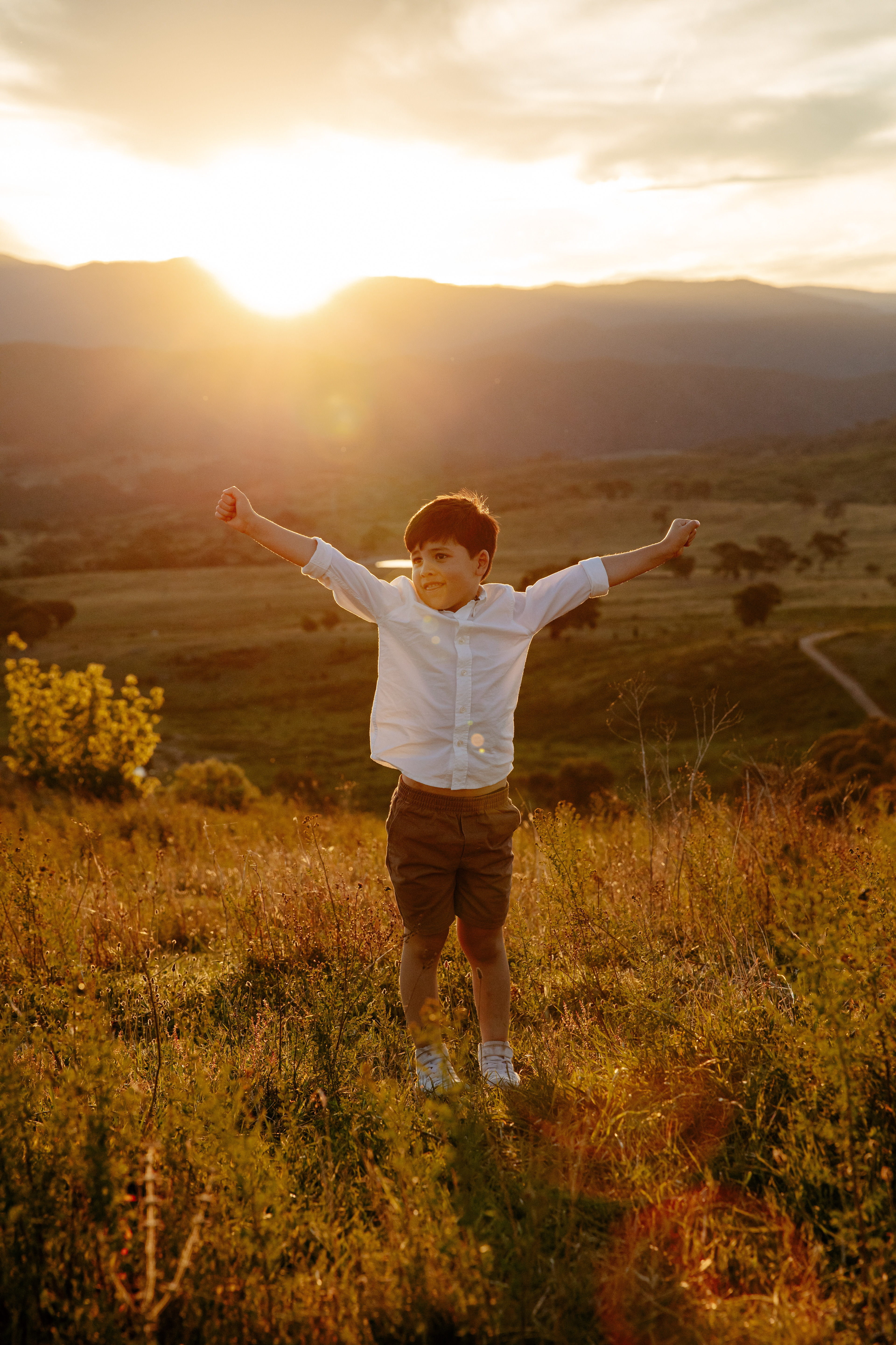 Canberra family photographer Olia Photography capturing candid family moments during a sunset session.