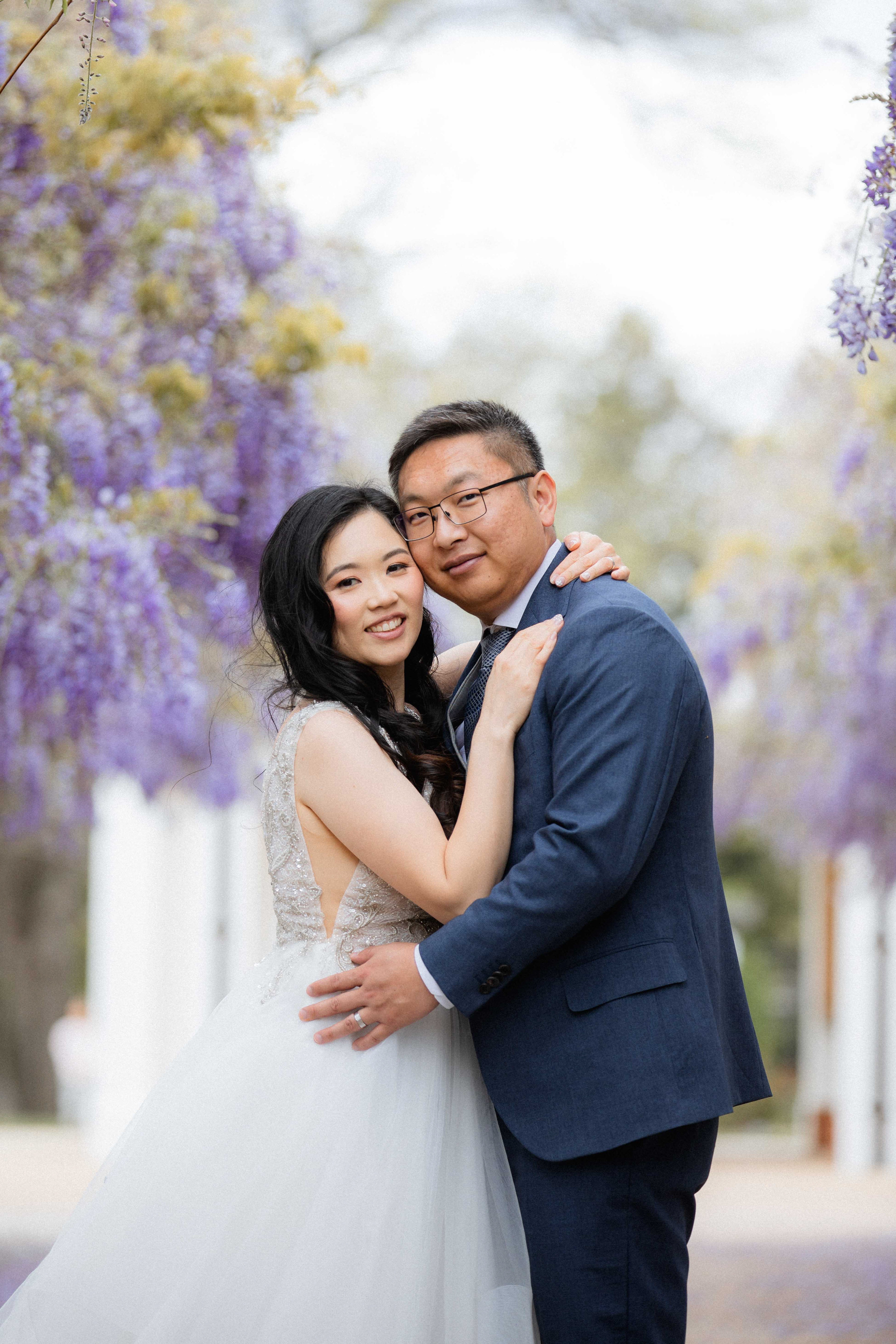 Wedding portraits beneath the wisteria at Old Parliament House. Captured by Olia Photography.