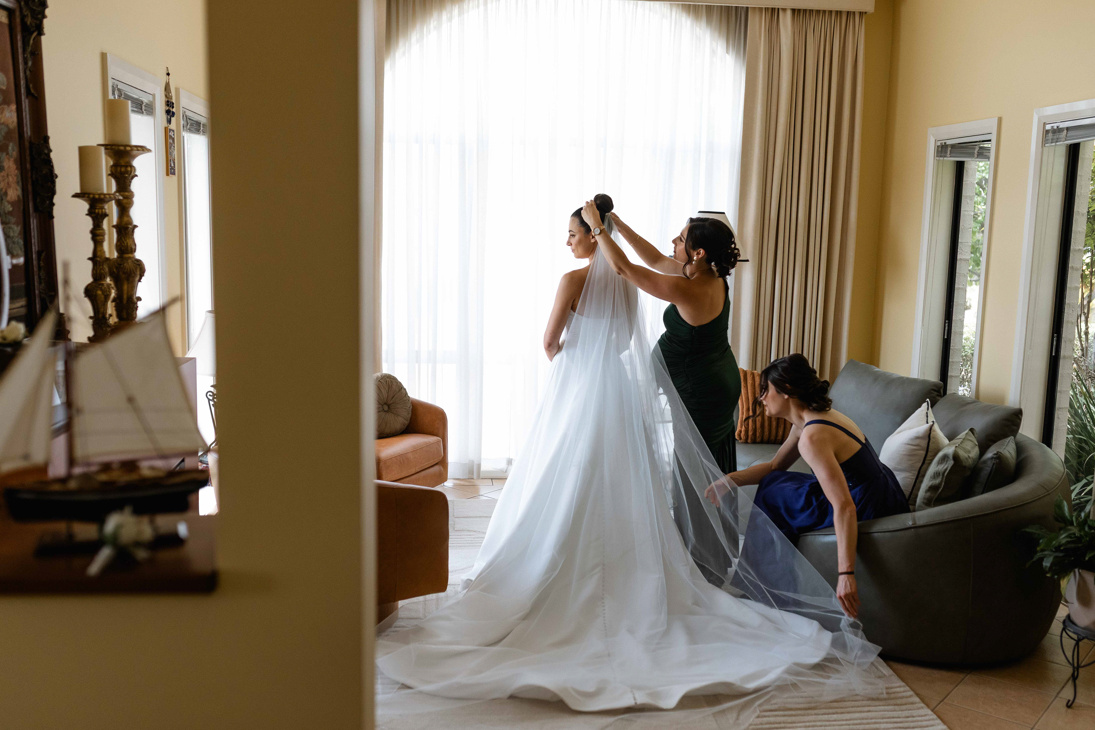 Bride getting ready on her wedding day. Captured by Olia Photography in Canberra.
