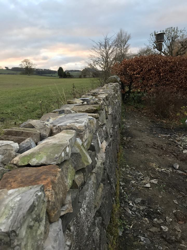 Limestone drystone wall rebuild in progress