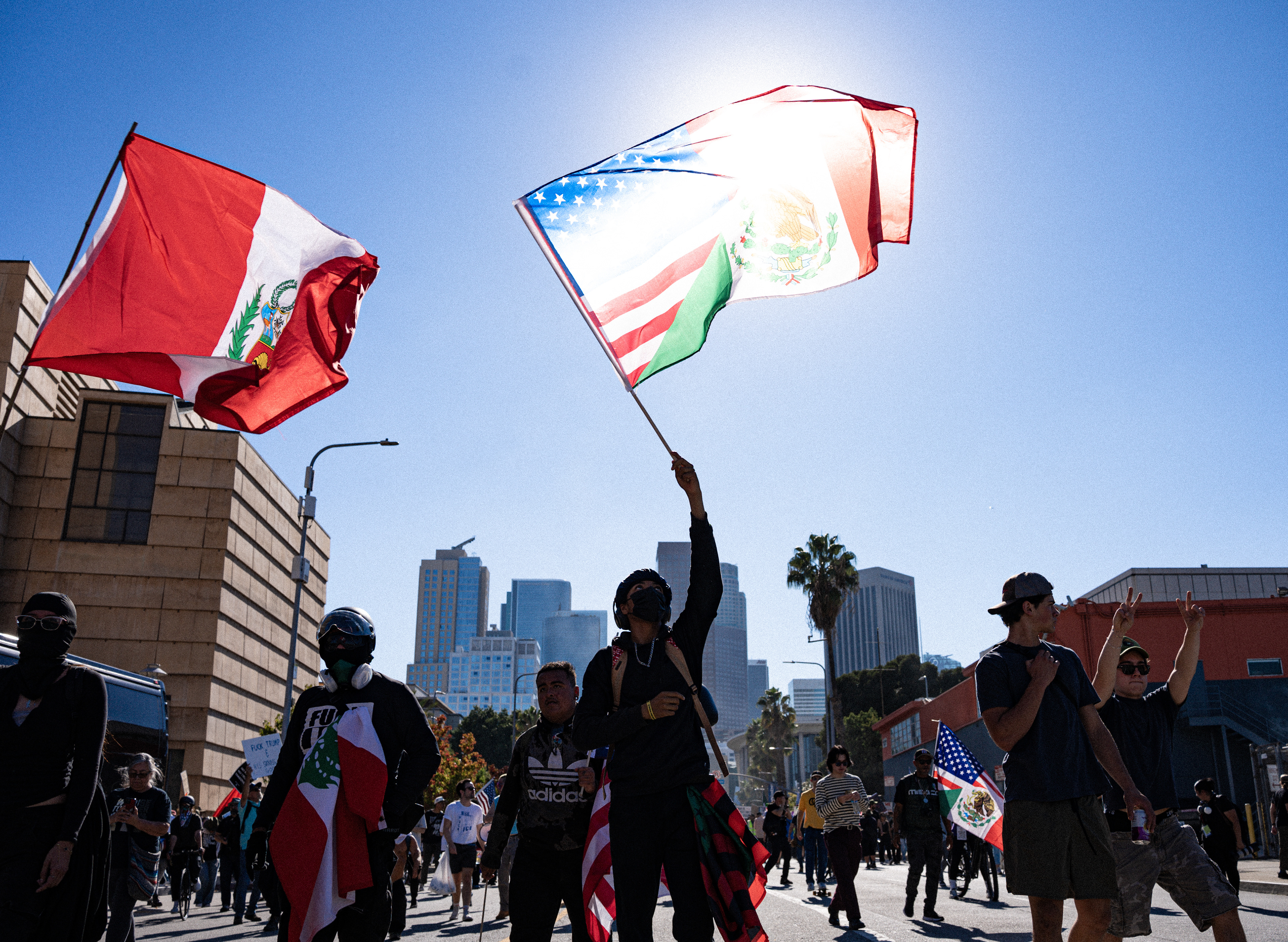 A protestor marches down Grand Ave. in Downtown Los Angeles during the No Kings Protest on Oct. 18, 2025. (Photo/Aston Smith)