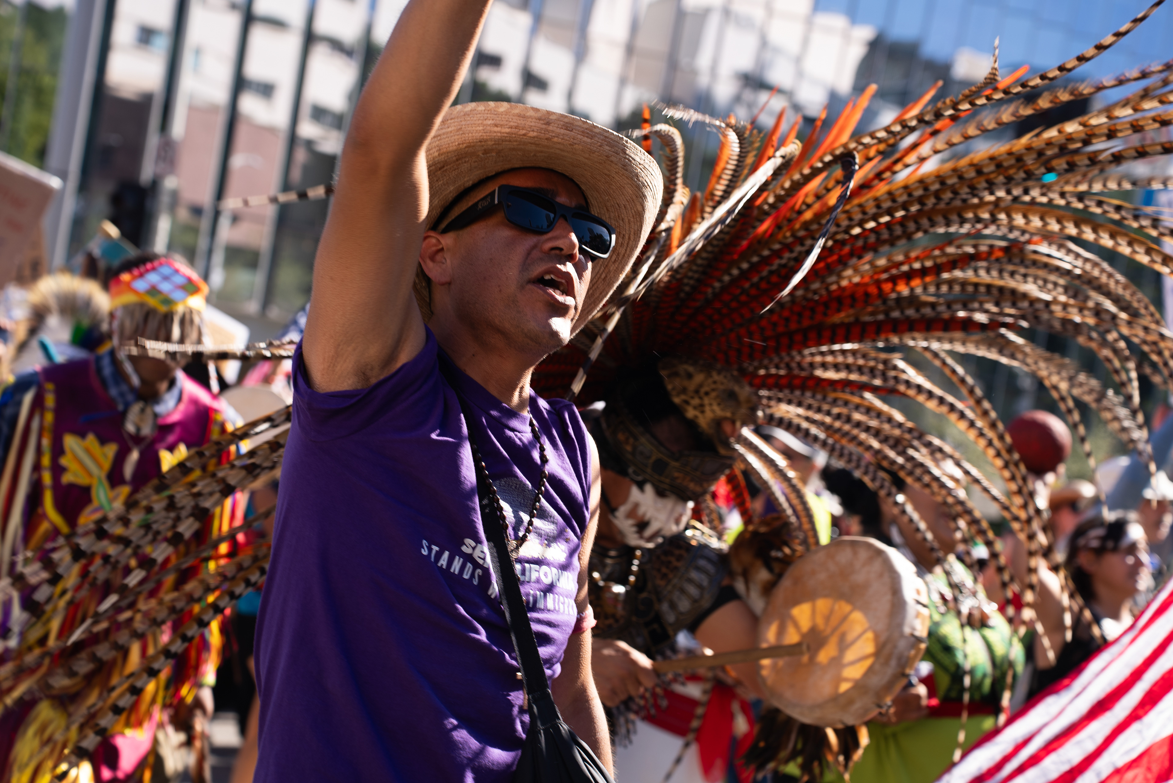 A protestor marches next to a Native American activist. The No Kings Protest in Downtown LA showed strong support for the Native American Community. Oct. 18, 2025. (Photo/Aston Smith)