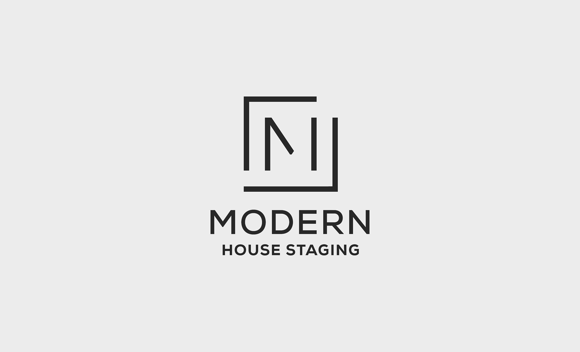 Modern House Staging logo, with stylized M surrounded in open-ended frame, in solid black.